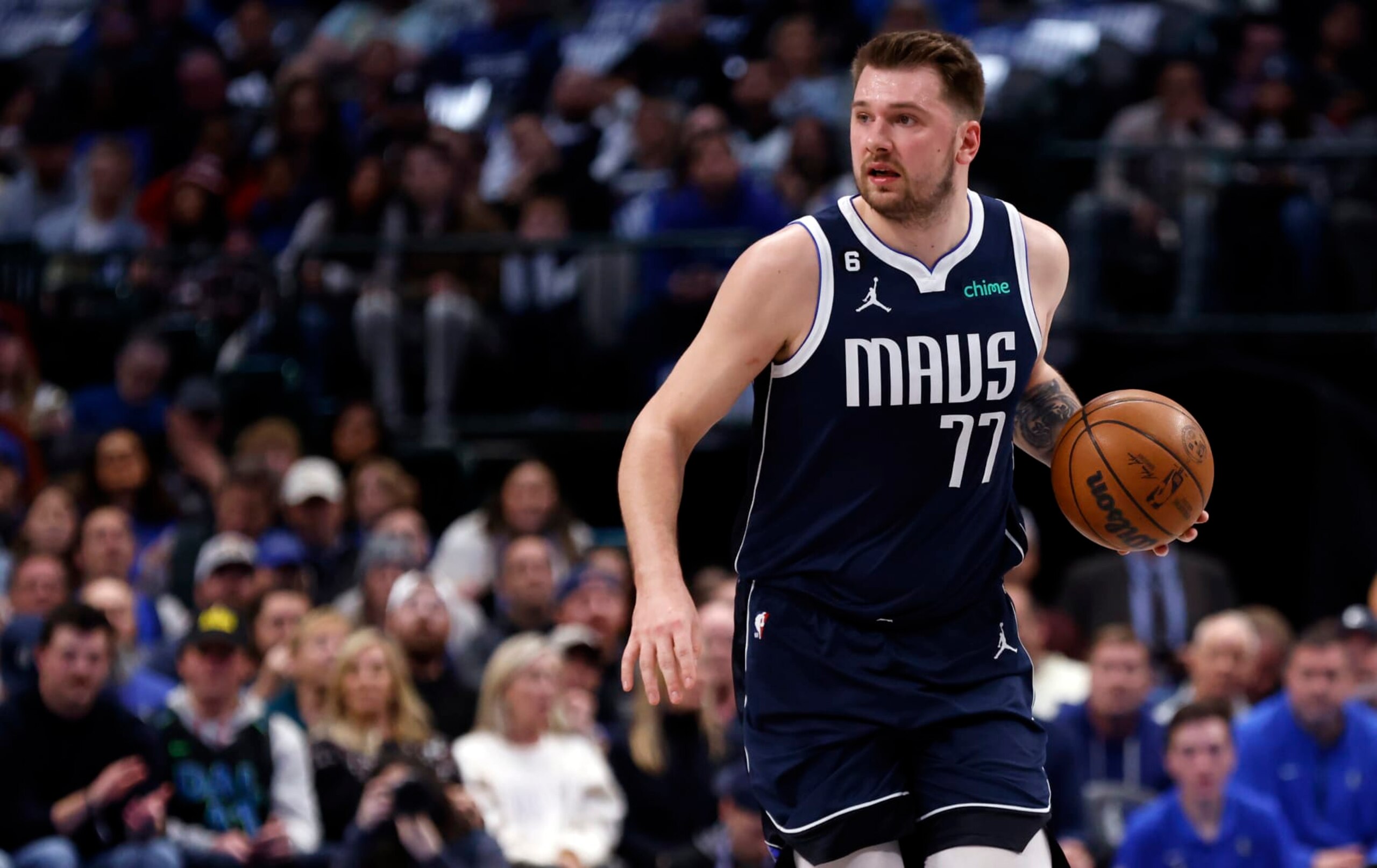 DALLAS, TX - FEBRUARY 2: Luka Doncic #77 of the Dallas Mavericks brings the ball up the court against the New Orleans Pelicans in the first half at American Airlines Center on February 2, 2023 in Dallas, Texas. NOTE TO USER: User expressly acknowledges and agrees that, by downloading and or using this photograph, user is consenting to the terms and conditions of the Getty Images License Agreement. (Photo by Ron Jenkins/Getty Images)