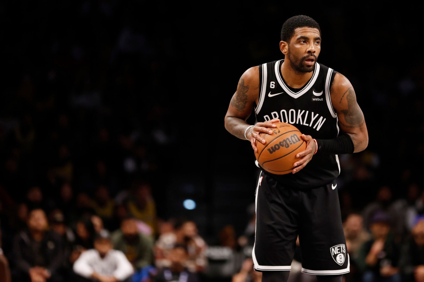 NEW YORK, NEW YORK - JANUARY 30: Kyrie Irving #11 of the Brooklyn Nets dribbles during the second half against the Los Angeles Lakers at Barclays Center on January 30, 2023 in the Brooklyn borough of New York City. The Nets won 121-104. NOTE TO USER: User expressly acknowledges and agrees that, by downloading and/or using this photograph, User is consenting to the terms and conditions of the Getty Images License Agreement. (Photo by Sarah Stier/Getty Images)