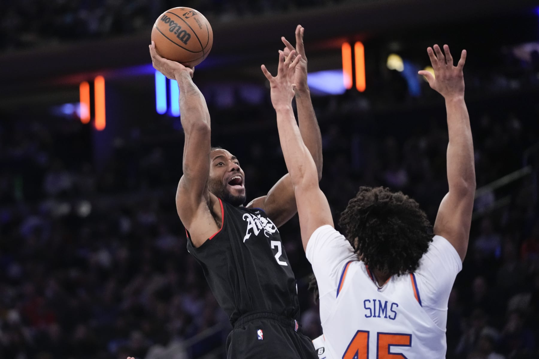Los Angeles Clippers forward Kawhi Leonard (2) goes to the basket against New York Knicks center Jericho Sims in the second half of an NBA basketball game, Saturday, Feb. 4, 2023, at Madison Square Garden in New York. The Clippers won 134-128. (AP Photo/Mary Altaffer)