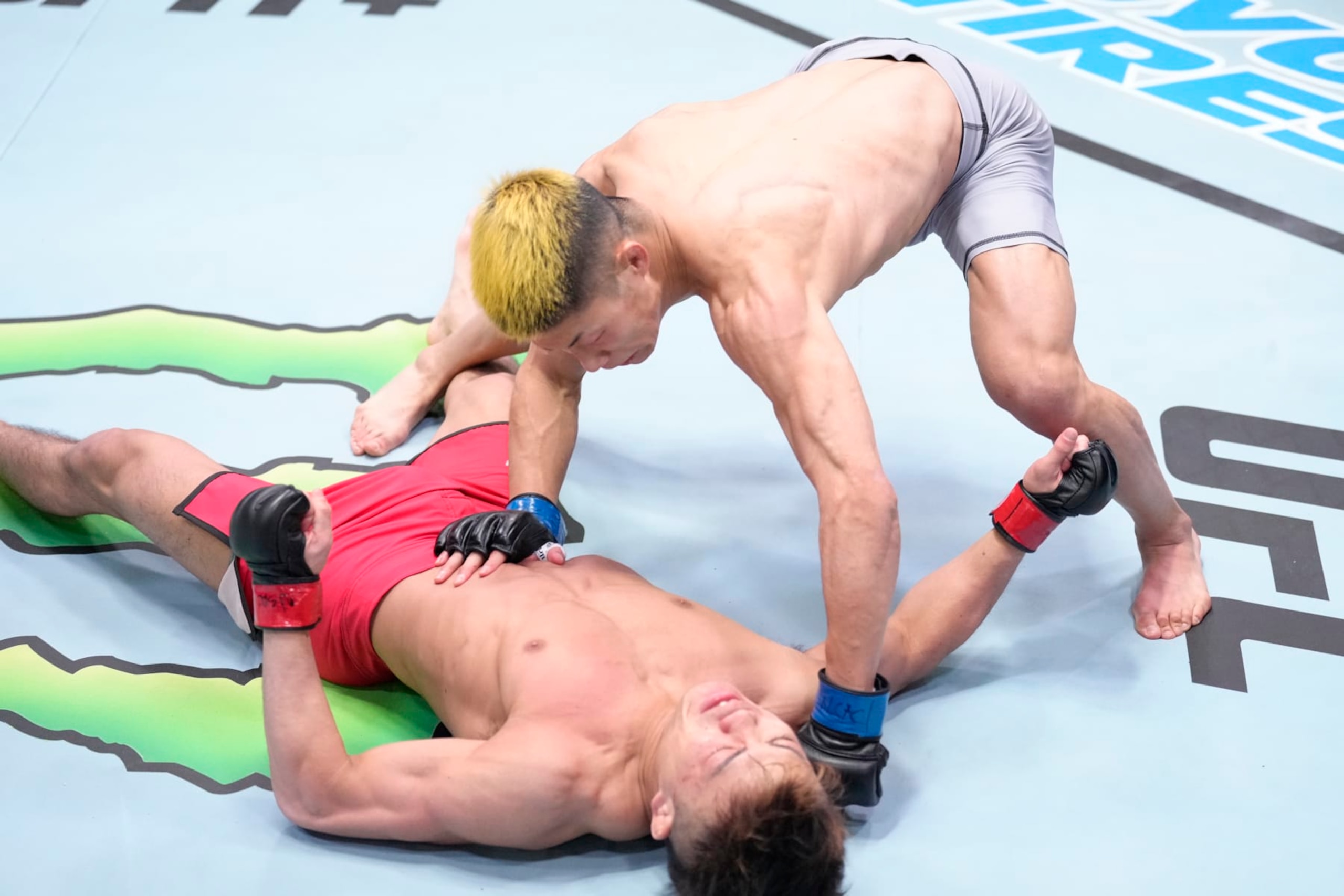 LAS VEGAS, NEVADA - FEBRUARY 04: (R-L) Rinya Nakamura of Japan knocks out Toshiomi Kazama of Japan in a bantamweight fight during the UFC Fight Night event at UFC APEX on February 04, 2023 in Las Vegas, Nevada. (Photo by Jeff Bottari/Zuffa LLC via Getty Images)