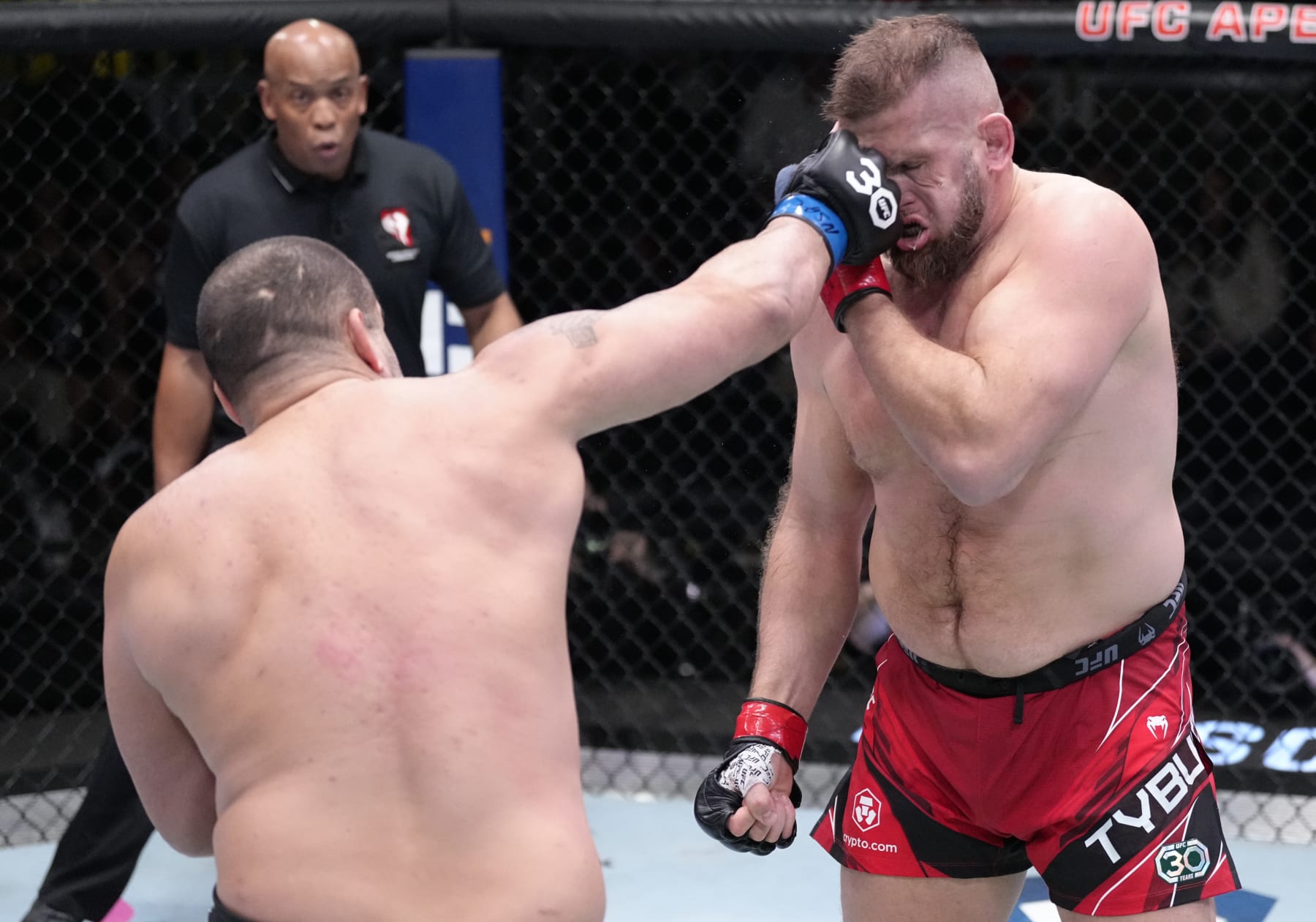 LAS VEGAS, NEVADA - FEBRUARY 04: (L-R) Blagoy Ivanov of Bulgaria punches Marcin Tybura of Poland in a heavyweight fight during the UFC Fight Night event at UFC APEX on February 04, 2023 in Las Vegas, Nevada. (Photo by Jeff Bottari/Zuffa LLC via Getty Images)