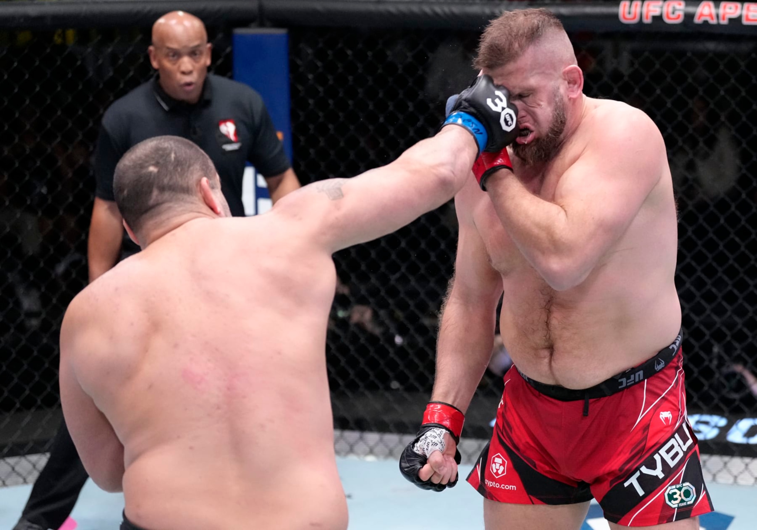 LAS VEGAS, NEVADA - FEBRUARY 04: (L-R) Blagoy Ivanov of Bulgaria punches Marcin Tybura of Poland in a heavyweight fight during the UFC Fight Night event at UFC APEX on February 04, 2023 in Las Vegas, Nevada. (Photo by Jeff Bottari/Zuffa LLC via Getty Images)