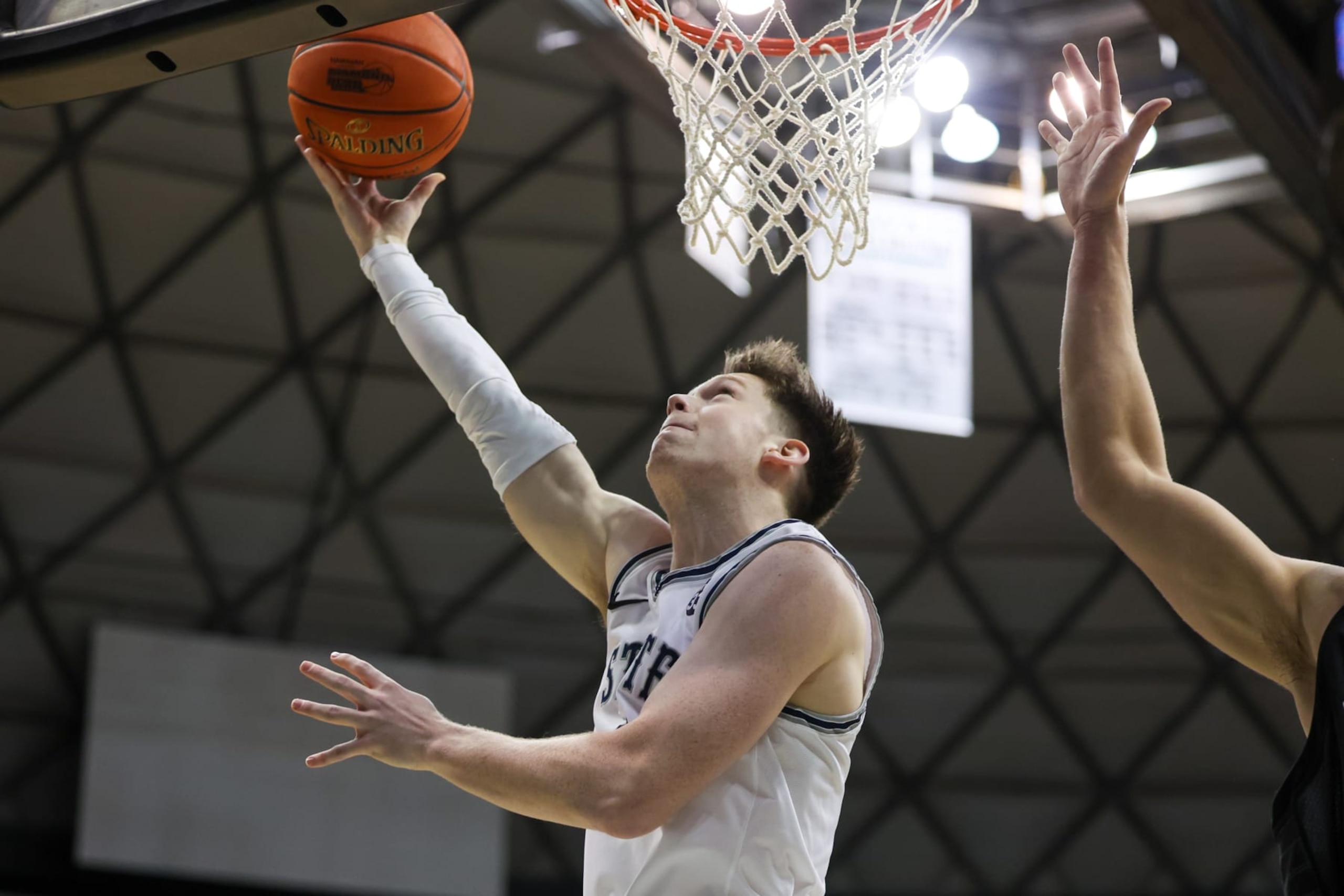 HONOLULU, HI - DECEMBER 22: Max Shulga #11 of the Utah State Aggies throws in a reverse layup during the first half the Hawaiian Airlines Diamond Head Classic game against the Seattle Redhawks at SimpliFi Arena on December 22, 2022 in Honolulu, Hawaii. (Photo by Darryl Oumi/Getty Images) HONOLULU, HI - DECEMBER 22: Max Shulga #11 of the Utah State Aggies throws in a reverse layup during the first half the Hawaiian Airlines Diamond Head Classic game against the Seattle Redhawks at SimpliFi Arena on December 22, 2022 in Honolulu, Hawaii. (Photo by Darryl Oumi/Getty Images)