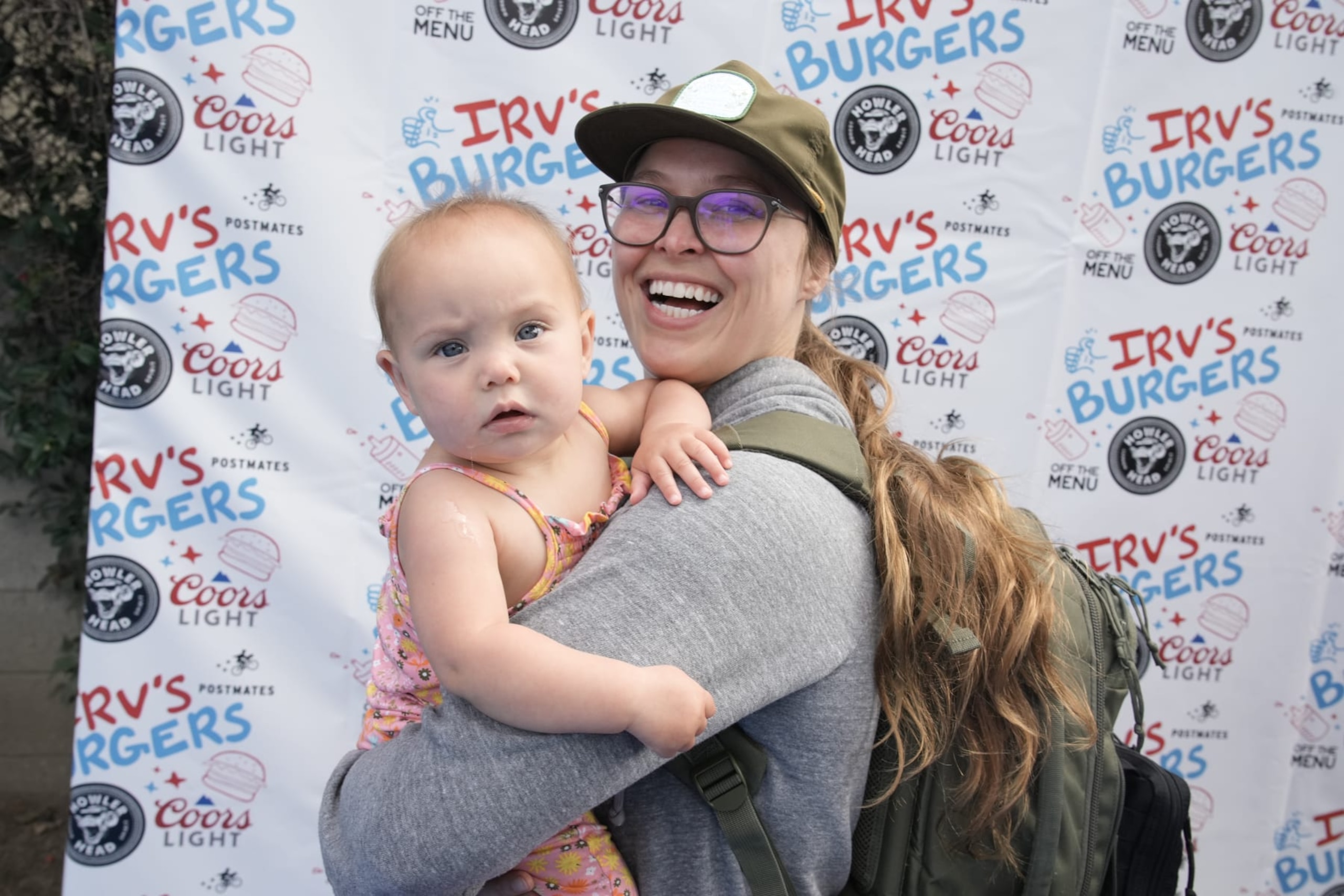 LOS ANGELES, CALIFORNIA - MAY 28: Ronda Rousey and La'akea Makalapuaokalanipo Browne celebrate National Burger Day at the friends and family preview party for the new Irv's Burgers on May 28, 2022 in Los Angeles, California. (Photo by Jeff Kravitz/FilmMagic)