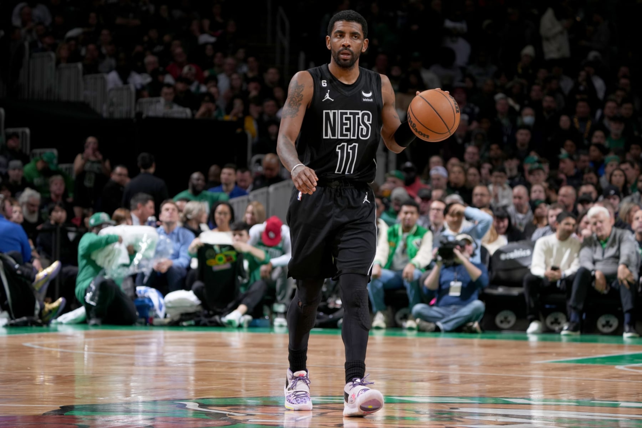 BOSTON, MA - FEBRUARY 1: Kyrie Irving #11 of the Brooklyn Nets moves the ball during the game against the Boston Celtics on February 1, 2023 at the TD Garden in Boston, Massachusetts. NOTE TO USER: User expressly acknowledges and agrees that, by downloading and or using this photograph, User is consenting to the terms and conditions of the Getty Images License Agreement. Mandatory Copyright Notice: Copyright 2023 NBAE  (Photo by Brian Babineau/NBAE via Getty Images)