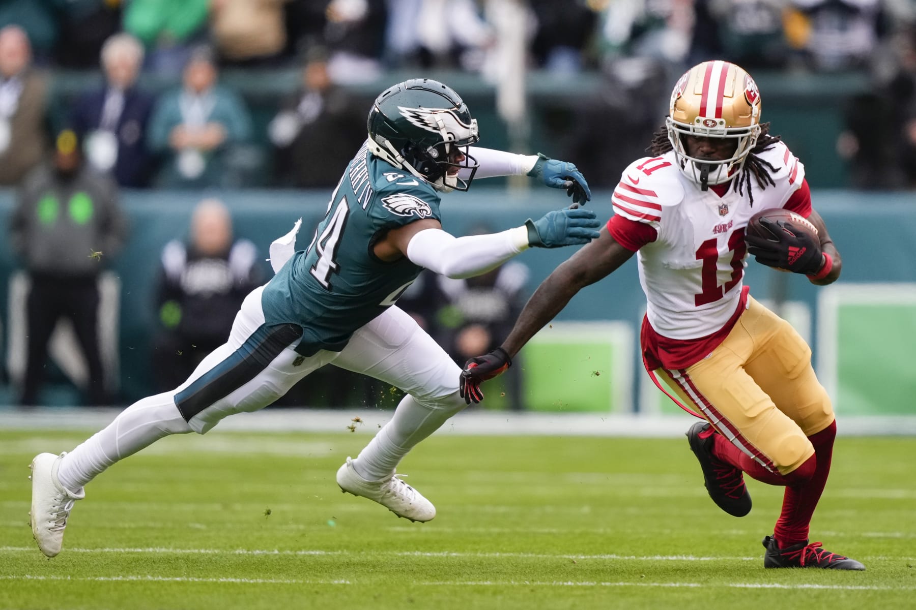 San Francisco 49ers wide receiver Brandon Aiyuk, right, runs with the ball against Philadelphia Eagles cornerback James Bradberry (24) during the first half of the NFC Championship NFL football game Sunday, Jan. 29, 2023, in Philadelphia. (AP Photo/Matt Rourke)