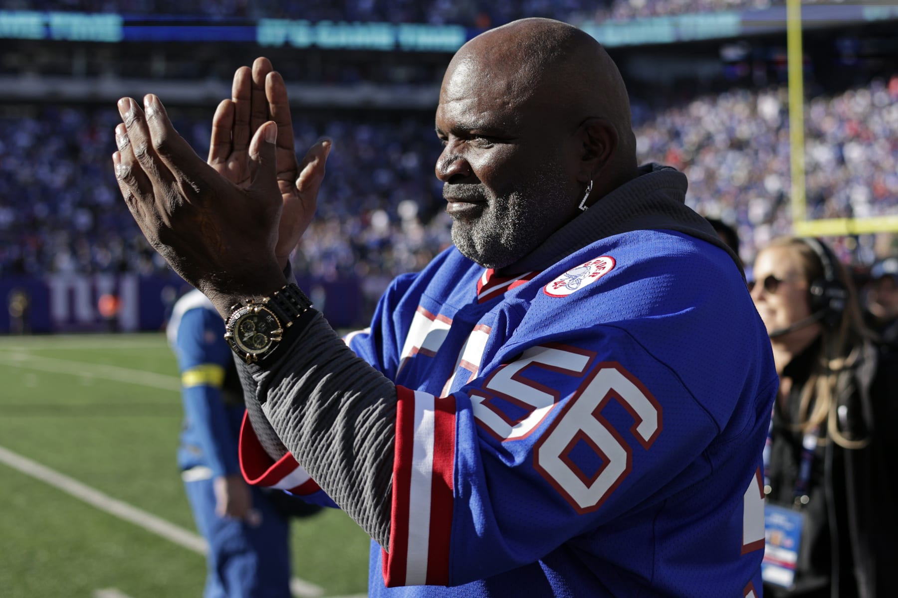 Former New York Giants' Lawrence Taylor walks on the field before an NFL football game against the Indianapolis Colts on Sunday, Jan. 1, 2023, in East Rutherford, N.J. (AP Photo/Adam Hunger)