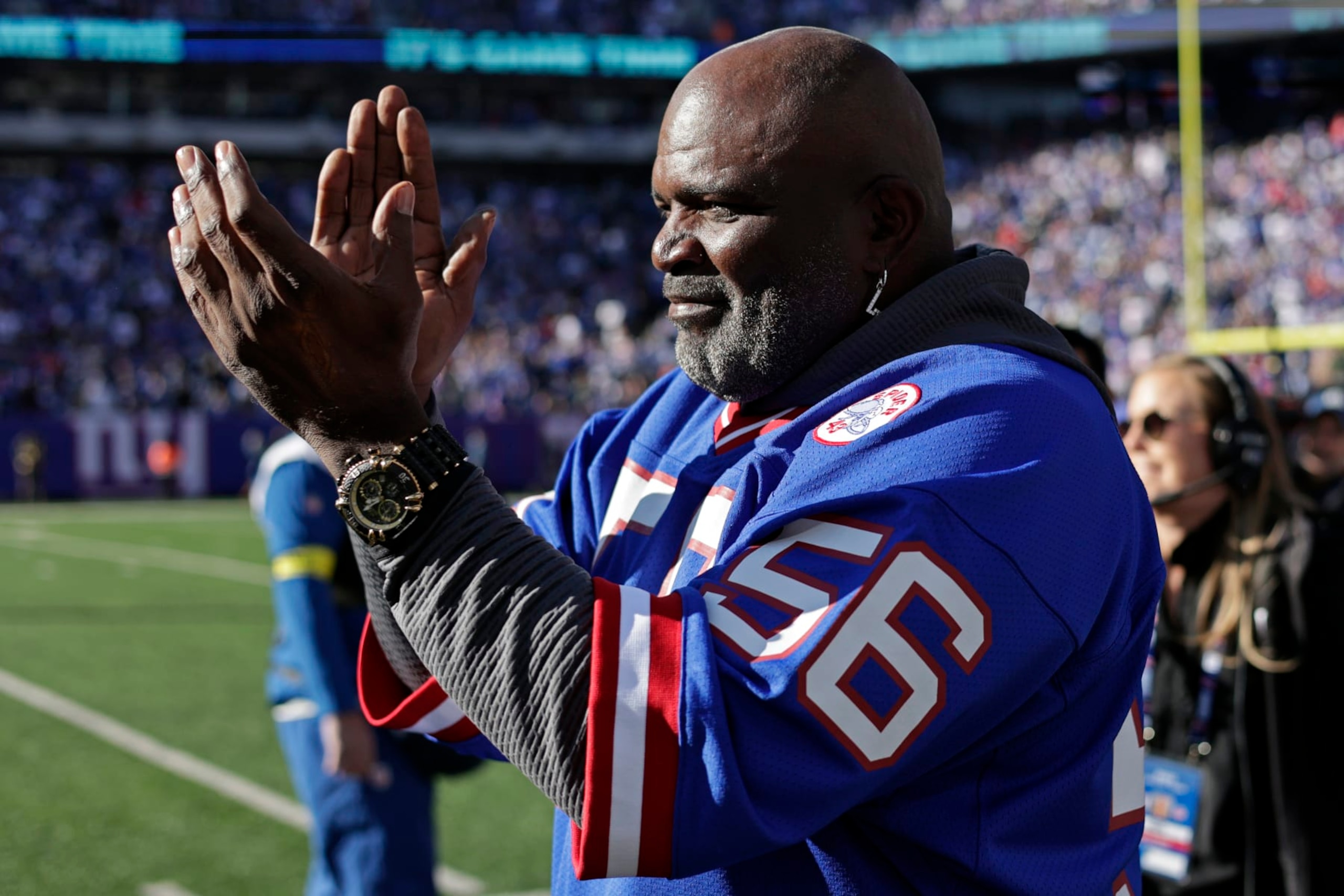 Former New York Giants' Lawrence Taylor walks on the field before an NFL football game against the Indianapolis Colts on Sunday, Jan. 1, 2023, in East Rutherford, N.J. (AP Photo/Adam Hunger)