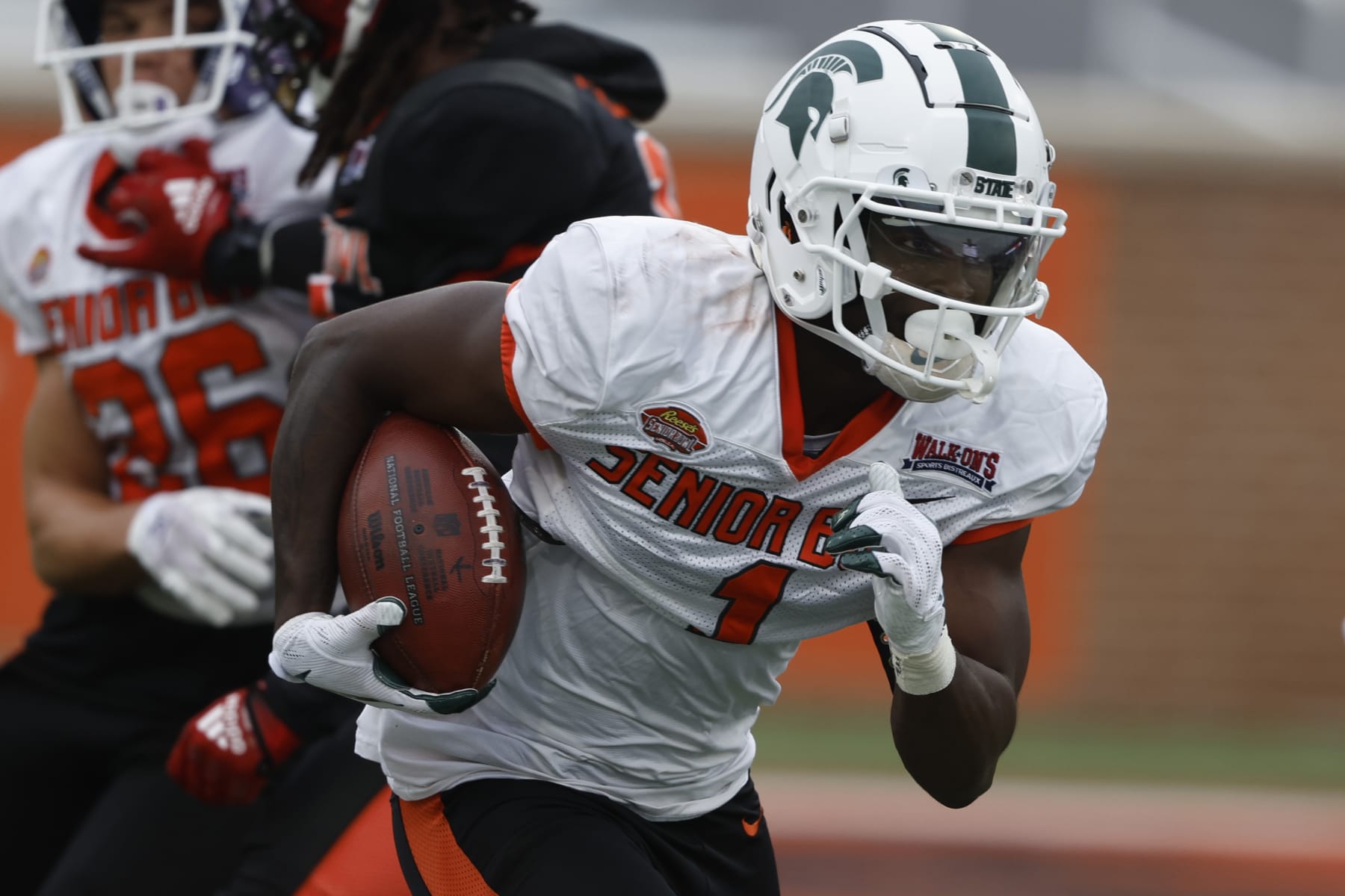 National wide receiver Jayden Reed of Michigan State (1) runs drills during practice for the Senior Bowl NCAA college football game Thursday, Feb. 2, 2023, in Mobile, Ala.. (AP Photo/Butch Dill)