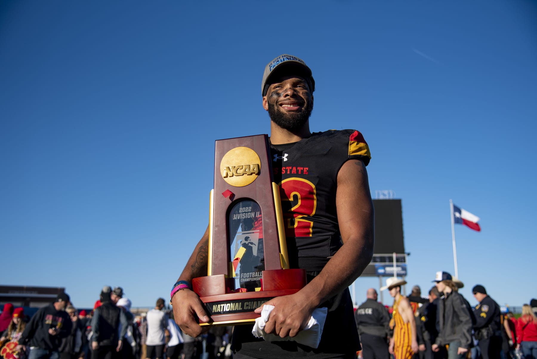 Ferris State defensive end Caleb Murphy (12) holds the NCAA Division II college football championship trophy on Saturday, Dec. 17, 2022 in McKinney, Texas. (AP Photo/Emil T. Lippe)