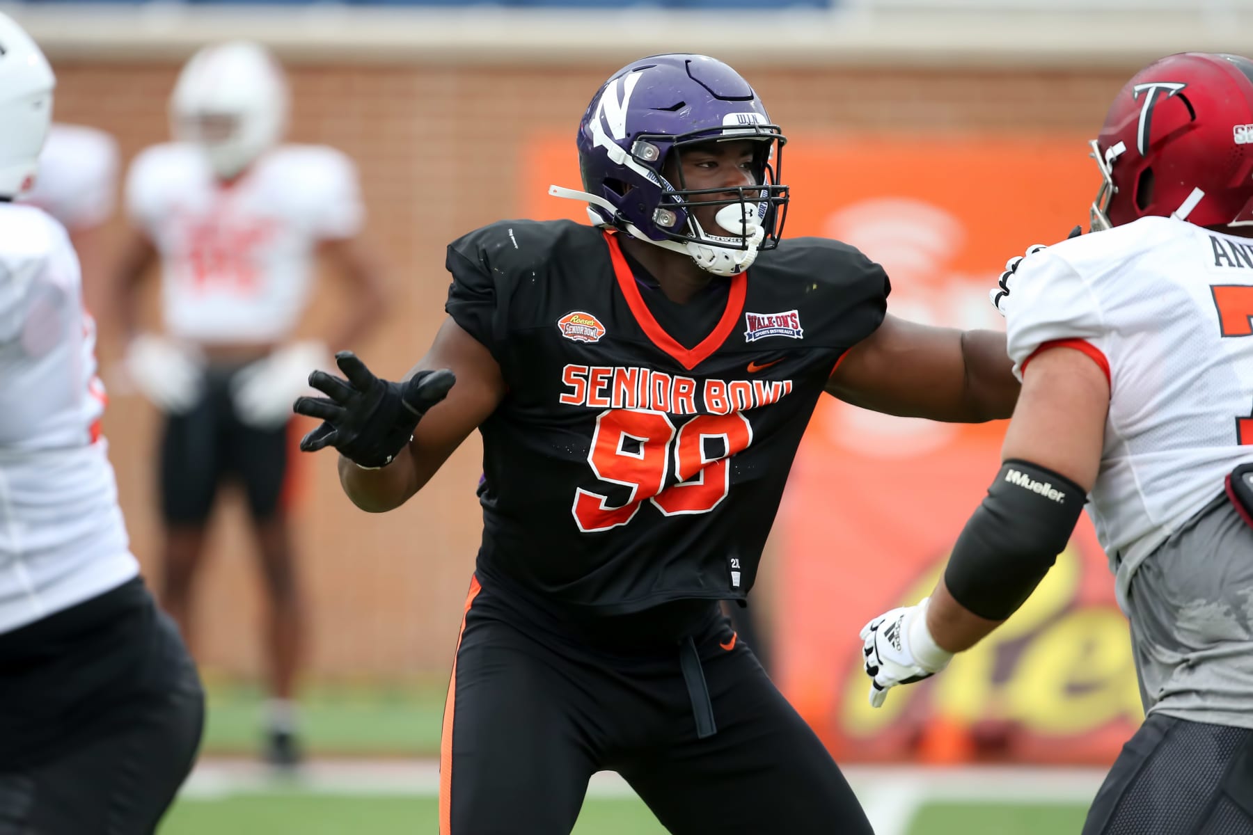 MOBILE, AL - FEBRUARY 02: National defensive lineman Adetomiwa Adebawore of Northwestern (99) during the Reese's Senior Bowl team practice session on February 2, 2023 at Hancock Whitney Stadium in Mobile, Alabama.  (Photo by Michael Wade/Icon Sportswire via Getty Images)