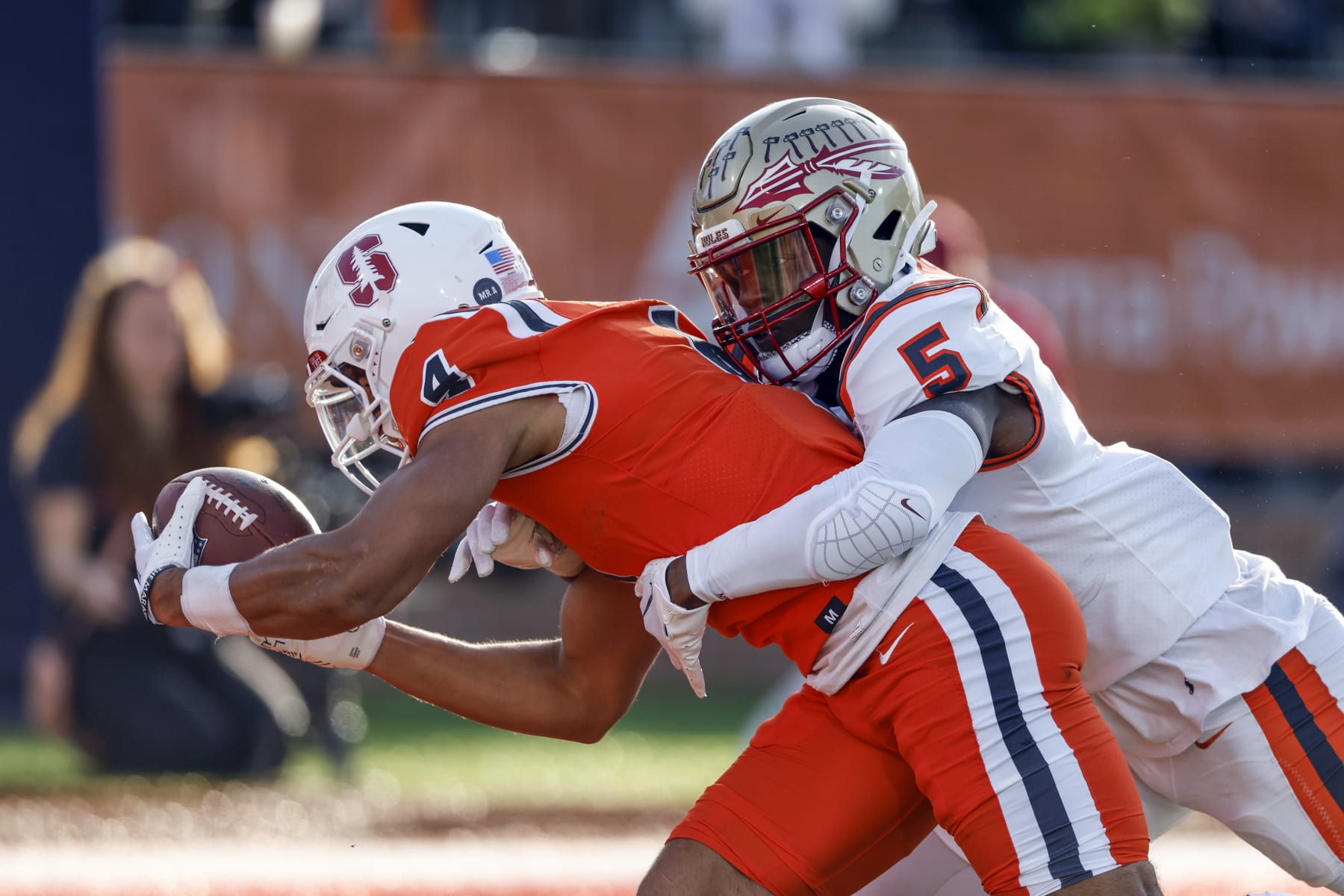 National wide receiver Michael Wilson of Stanford (4) reaches for the end zone for a touchdown as American defensive back Jammie Robinson of Florida State (5) defends during the second half of the Senior Bowl NCAA college football game, Saturday, Feb. 4, 2023, in Mobile, Ala.. (AP Photo/Butch Dill)