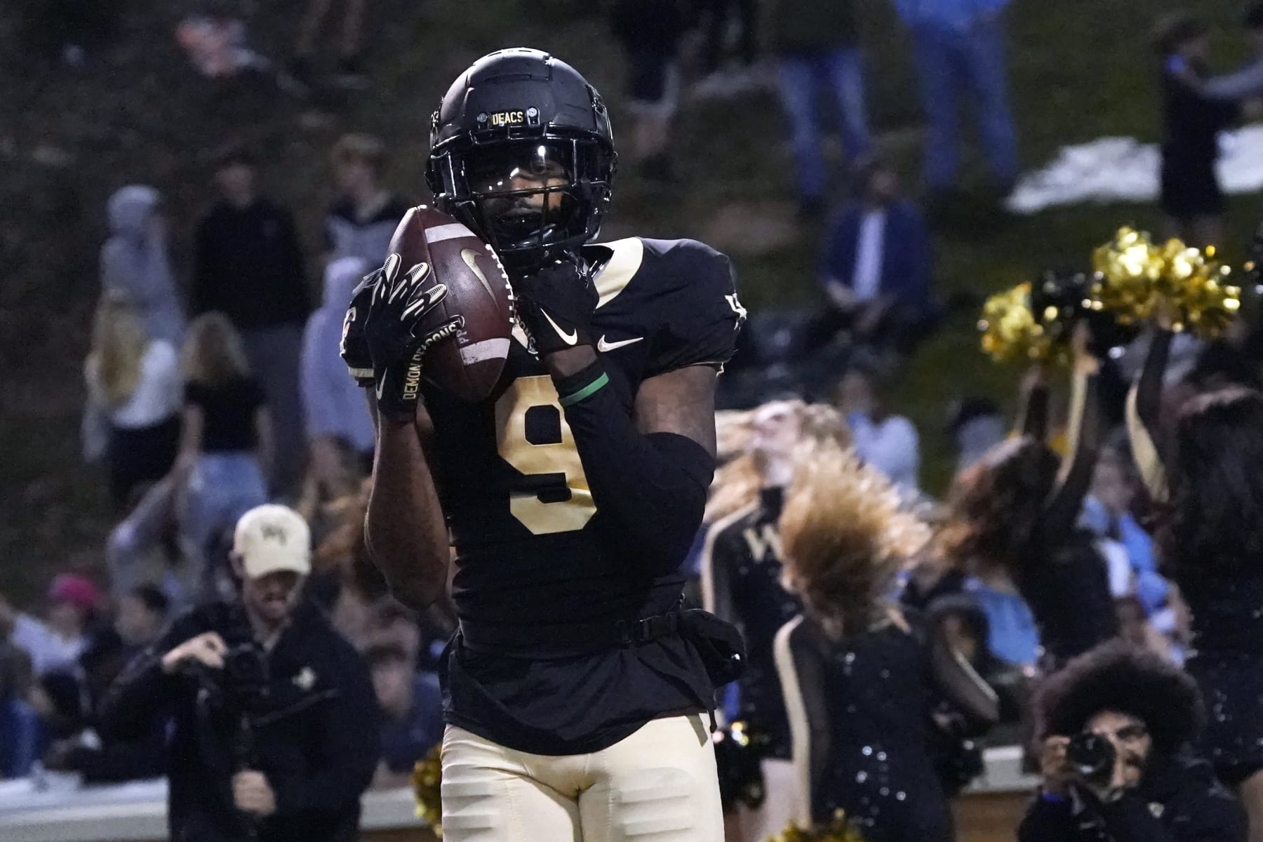 Wake Forest wide receiver A.T. Perry (9) celebrates his touchdown catch against North Carolina during the second half of an NCAA college football game in Winston-Salem, N.C., Saturday, Nov. 12, 2022. (AP Photo/Chuck Burton)