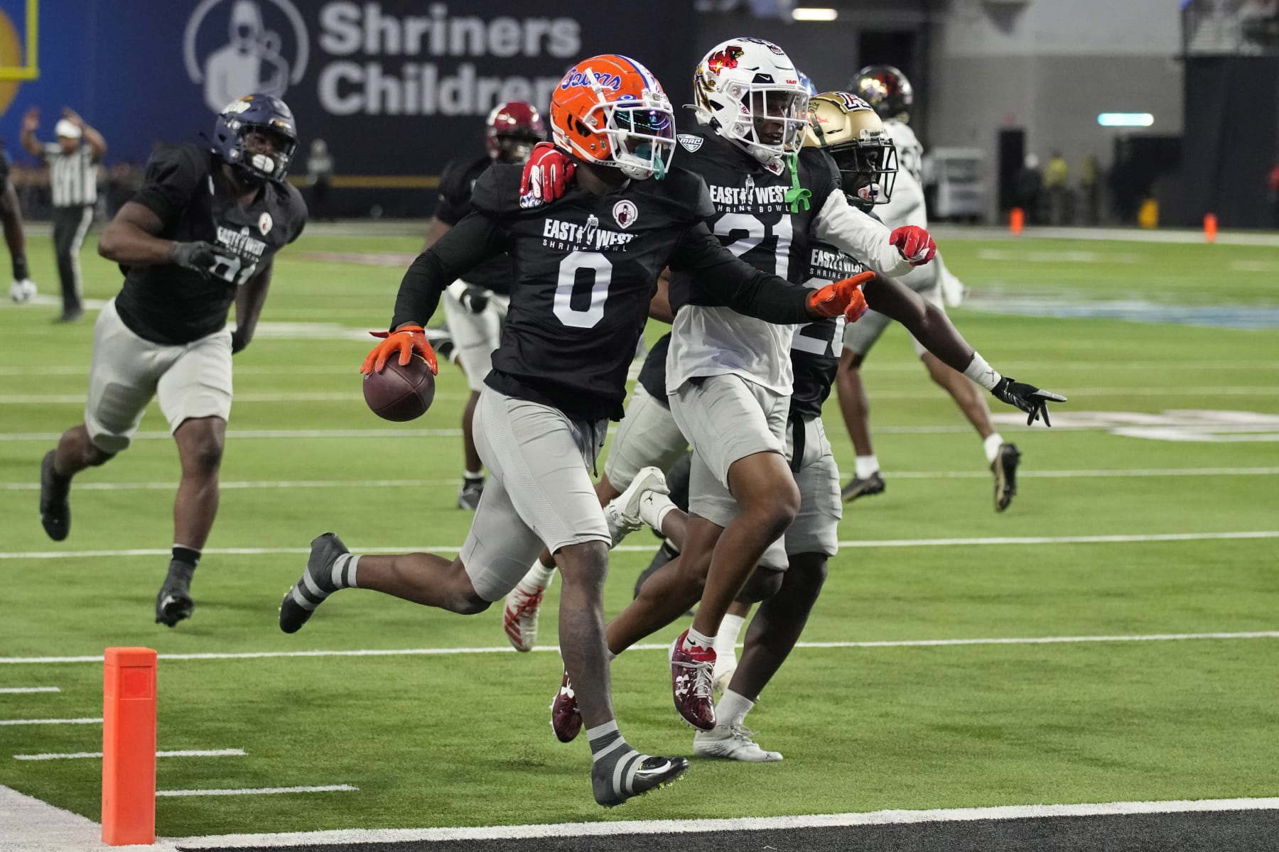 West safety Trey Dean III (0) of Florida celebrates after making an interception against East during the first half of the East-West Shrine Bowl NCAA college football game Thursday, Feb. 2, 2023, in Las Vegas. (AP Photo/John Locher)