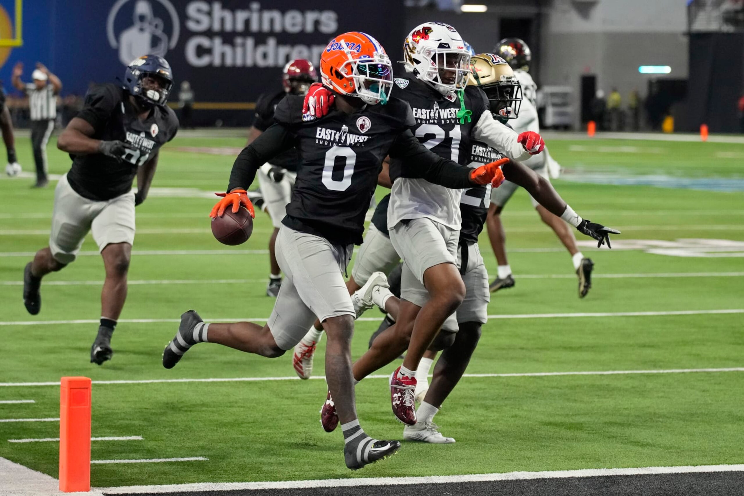 West safety Trey Dean III (0) of Florida celebrates after making an interception against East during the first half of the East-West Shrine Bowl NCAA college football game Thursday, Feb. 2, 2023, in Las Vegas. (AP Photo/John Locher)