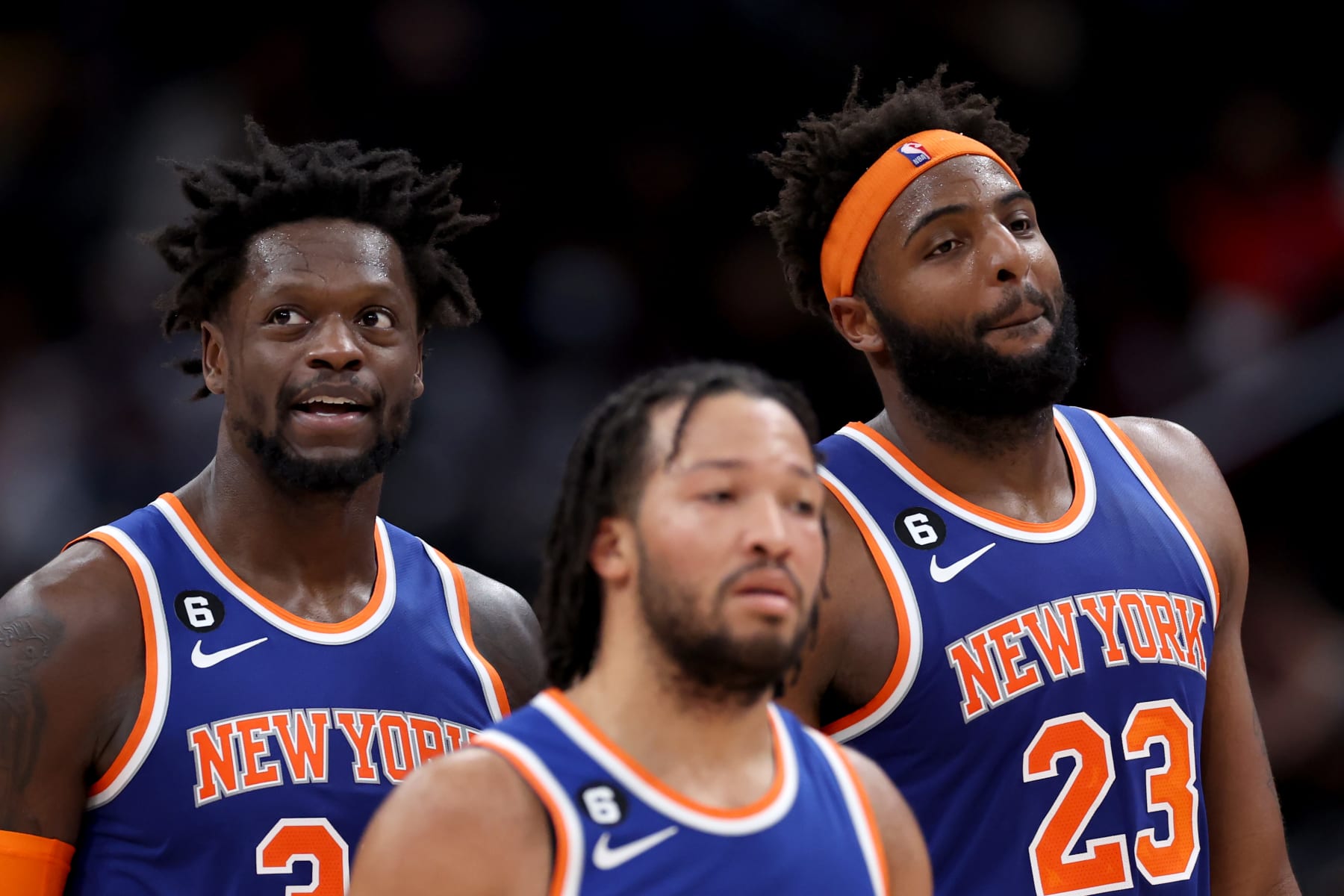 WASHINGTON, DC - JANUARY 13: Julius Randle #30, Jalen Brunson #11, and Mitchell Robinson #23 of the New York Knicks look on in the second half against the Washington Wizards at Capital One Arena on January 13, 2023 in Washington, DC. NOTE TO USER: User expressly acknowledges and agrees that, by downloading and or using this photograph, User is consenting to the terms and conditions of the Getty Images License Agreement.  (Photo by Rob Carr/Getty Images)