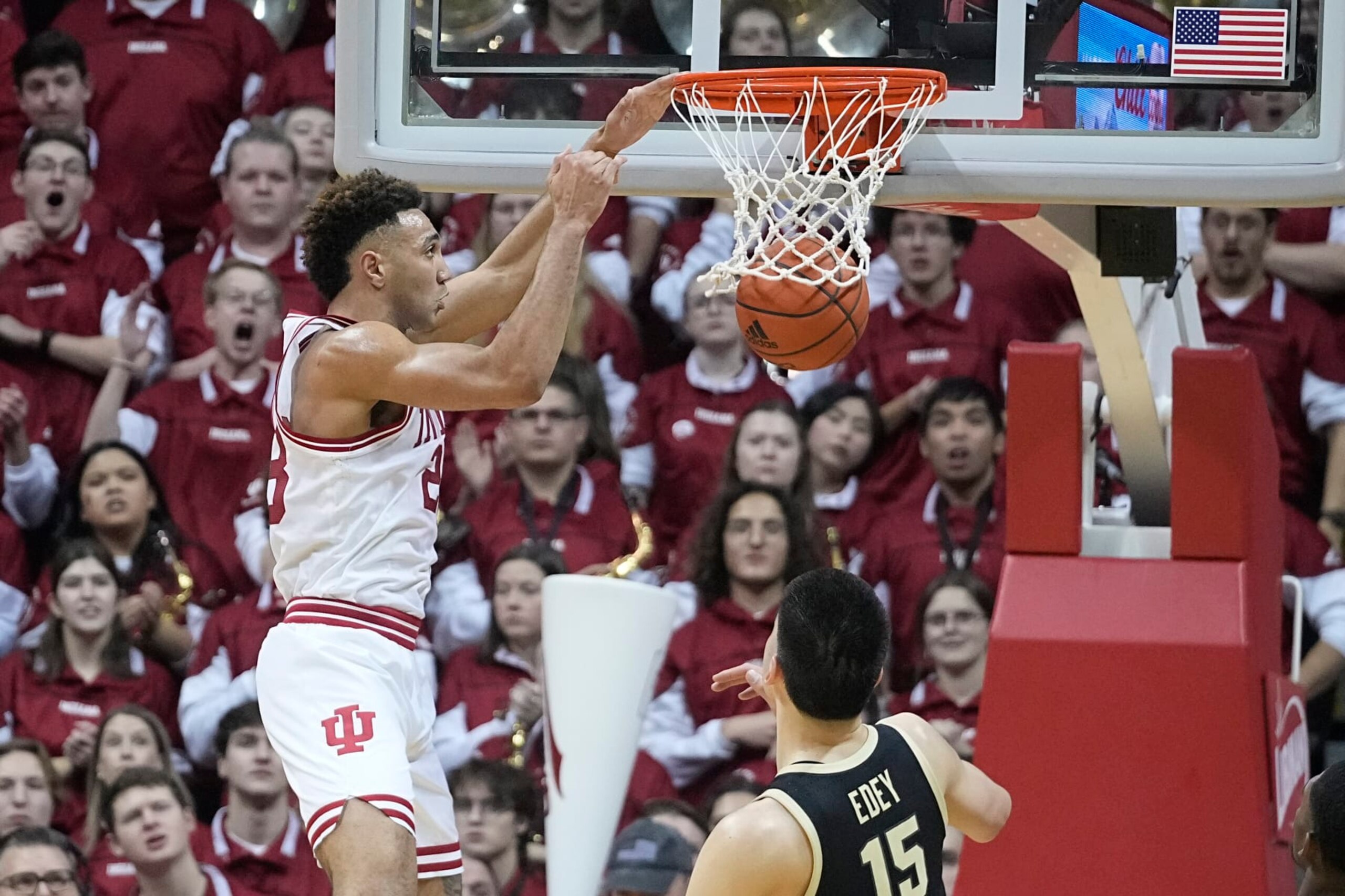 Indiana's Trayce Jackson-Davis, left, dunks against Purdue's Zach Edey (15) during the first half of an NCAA college basketball game, Saturday, Feb. 4, 2023, in Bloomington, Ind. (AP Photo/Darron Cummings)