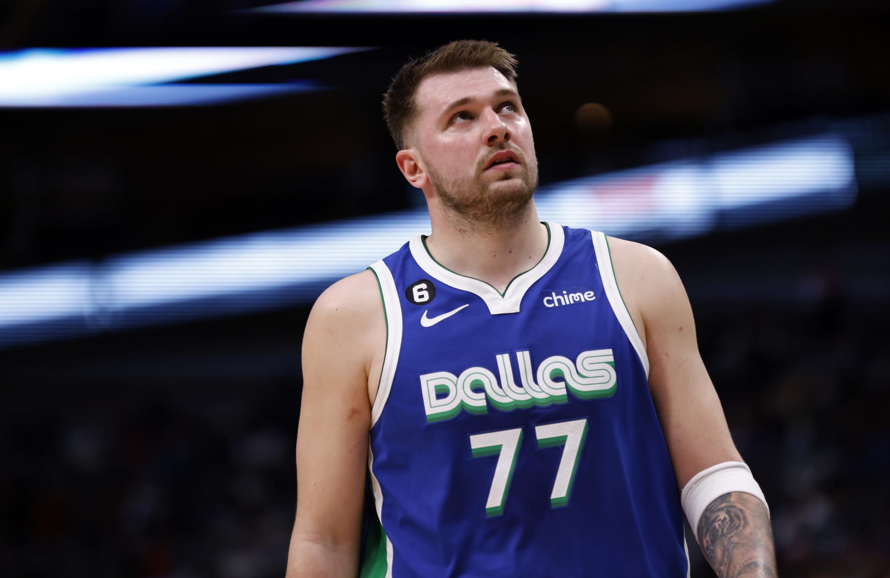 DALLAS, TX - JANUARY 30: Luka Doncic #77 of the Dallas Mavericks looks on against the Detroit Pistons in the second half at American Airlines Center on January 30, 2023 in Dallas, Texas. The Mavericks won 111-105. NOTE TO USER: User expressly acknowledges and agrees that, by downloading and or using this photograph, User is consenting to the terms and conditions of the Getty Images License Agreement. (Photo by Ron Jenkins/Getty Images)