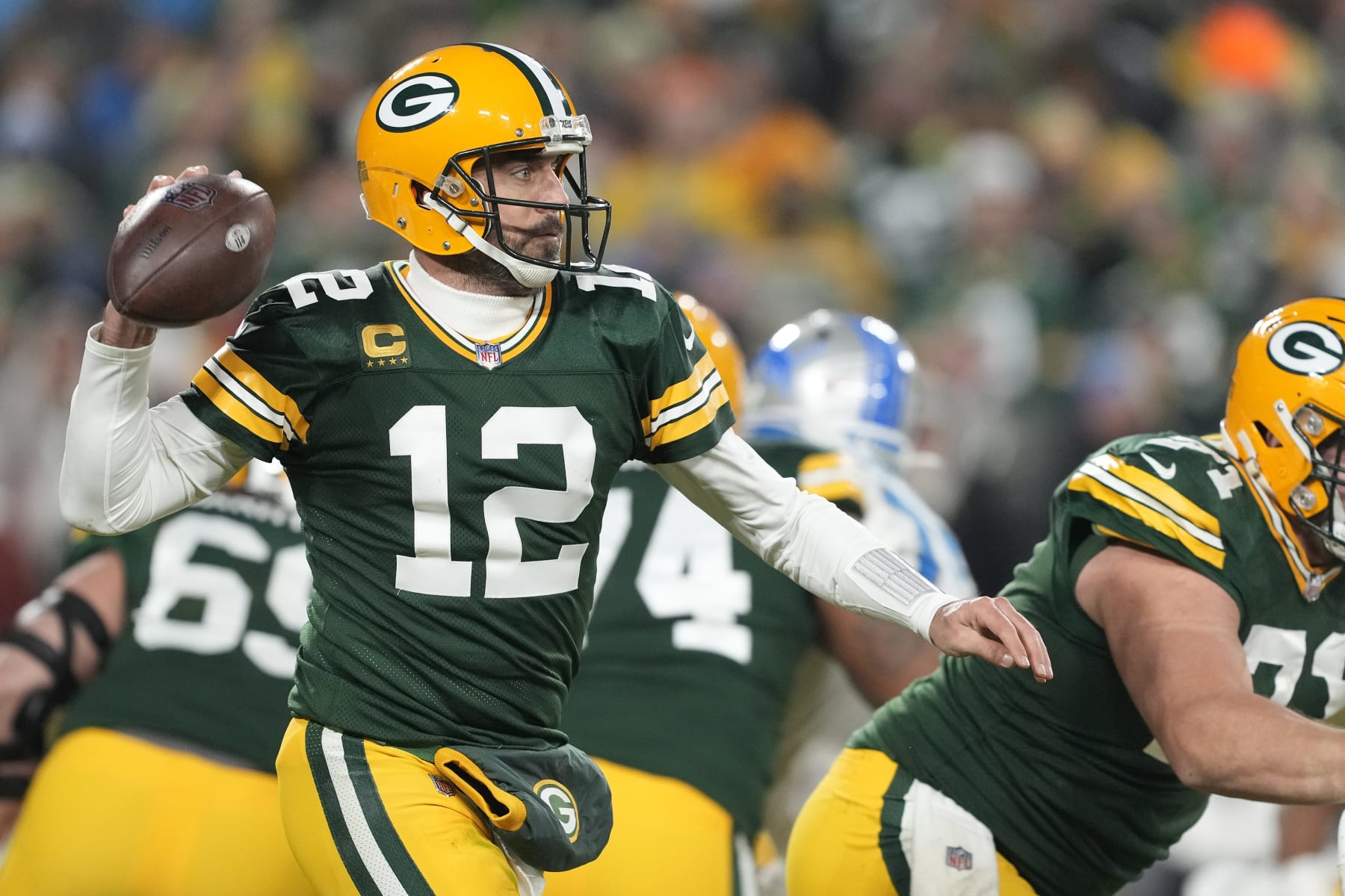 GREEN BAY, WISCONSIN - JANUARY 08: Aaron Rodgers #12 of the Green Bay Packers throws a pass against the Detroit Lions in the second half at Lambeau Field on January 08, 2023 in Green Bay, Wisconsin. (Photo by Patrick McDermott/Getty Images)