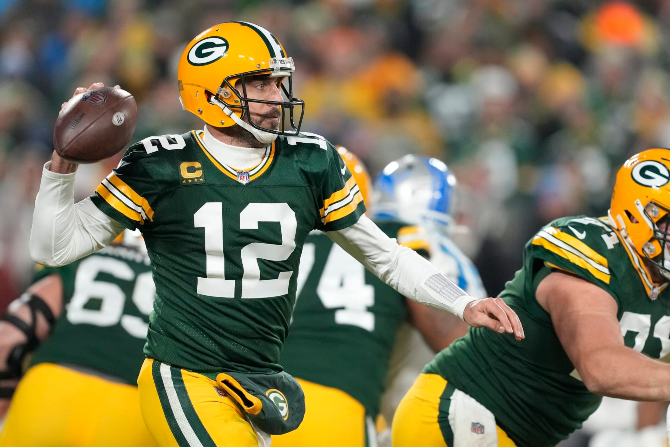 GREEN BAY, WISCONSIN - JANUARY 08: Aaron Rodgers #12 of the Green Bay Packers throws a pass against the Detroit Lions in the second half at Lambeau Field on January 08, 2023 in Green Bay, Wisconsin. (Photo by Patrick McDermott/Getty Images)