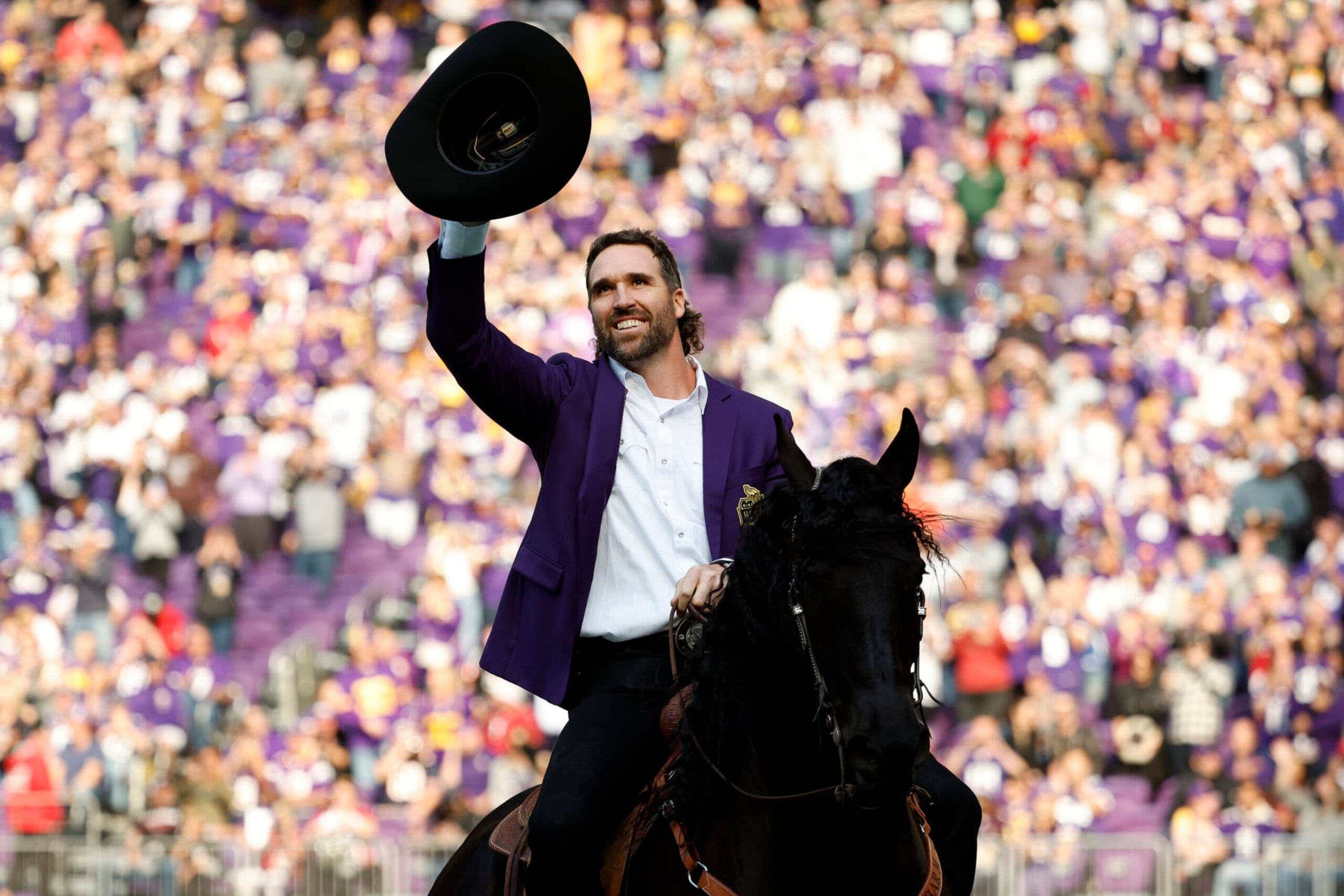 MINNEAPOLIS, MINNESOTA - OCTOBER 30: Jared Allen, former defensive end of the Minnesota Vikings, celebrates as he is inducted into the Vikings' Ring of Honor during halftime at U.S. Bank Stadium on October 30, 2022 in Minneapolis, Minnesota. (Photo by David Berding/Getty Images)