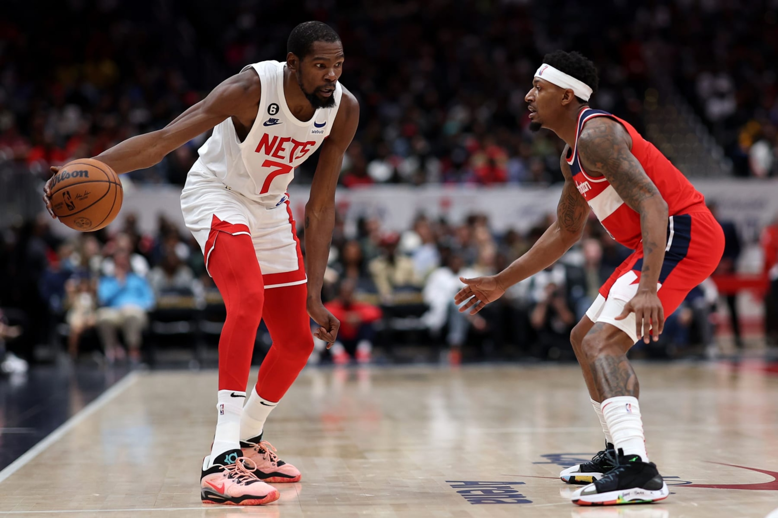 WASHINGTON, DC - NOVEMBER 04: Kevin Durant #7 of the Brooklyn Nets is guarded by Bradley Beal #3 of the Washington Wizards during the first half at Capital One Arena on November 4, 2022 in Washington, DC. NOTE TO USER: User expressly acknowledges and agrees that, by downloading and or using this photograph, User is consenting to the terms and conditions of the Getty Images License Agreement. (Photo by Patrick Smith/Getty Images)