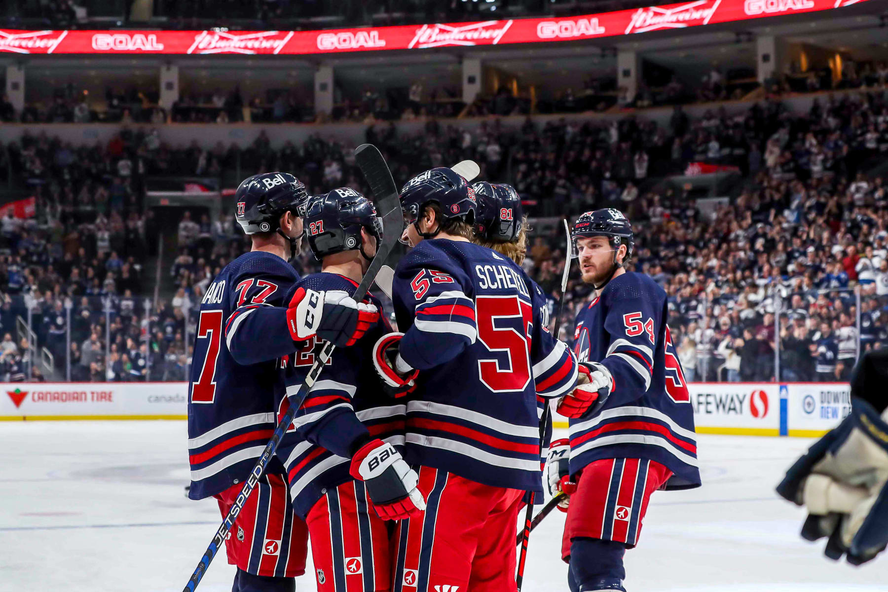 WINNIPEG, CANADA - JANUARY 30: Kyle Capobianco #77, Nikolaj Ehlers #27, Mark Scheifele #55, Kyle Connor #81 and Dylan Samberg #54 of the Winnipeg Jets celebrate a third period goal against the St. Louis Blues at the Canada Life Centre on January 30, 2023 in Winnipeg, Manitoba, Canada. (Photo by Darcy Finley/NHLI via Getty Images)