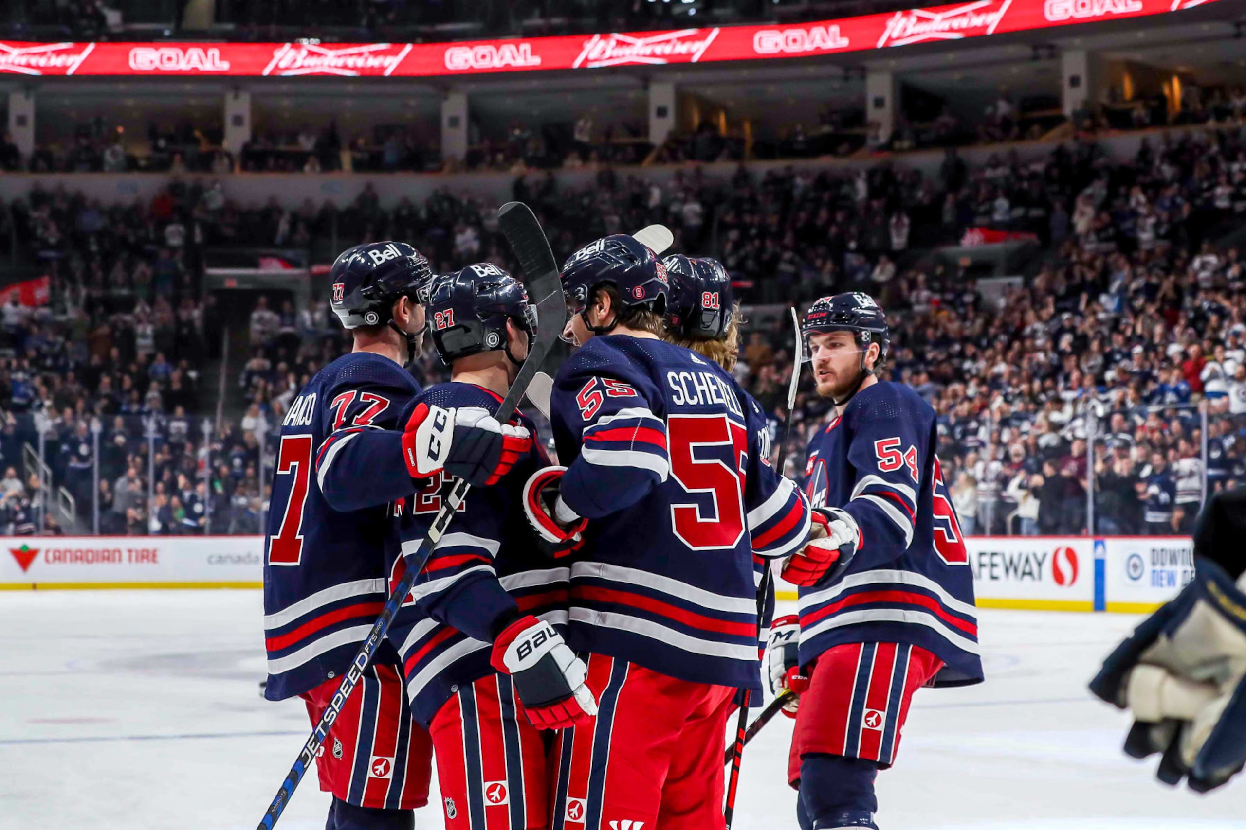 WINNIPEG, CANADA - JANUARY 30: Kyle Capobianco #77, Nikolaj Ehlers #27, Mark Scheifele #55, Kyle Connor #81 and Dylan Samberg #54 of the Winnipeg Jets celebrate a third period goal against the St. Louis Blues at the Canada Life Centre on January 30, 2023 in Winnipeg, Manitoba, Canada. (Photo by Darcy Finley/NHLI via Getty Images) WINNIPEG, CANADA - JANUARY 30: Kyle Capobianco #77, Nikolaj Ehlers #27, Mark Scheifele #55, Kyle Connor #81 and Dylan Samberg #54 of the Winnipeg Jets celebrate a third period goal against the St. Louis Blues at the Canada Life Centre on January 30, 2023 in Winnipeg, Manitoba, Canada. (Photo by Darcy Finley/NHLI via Getty Images)