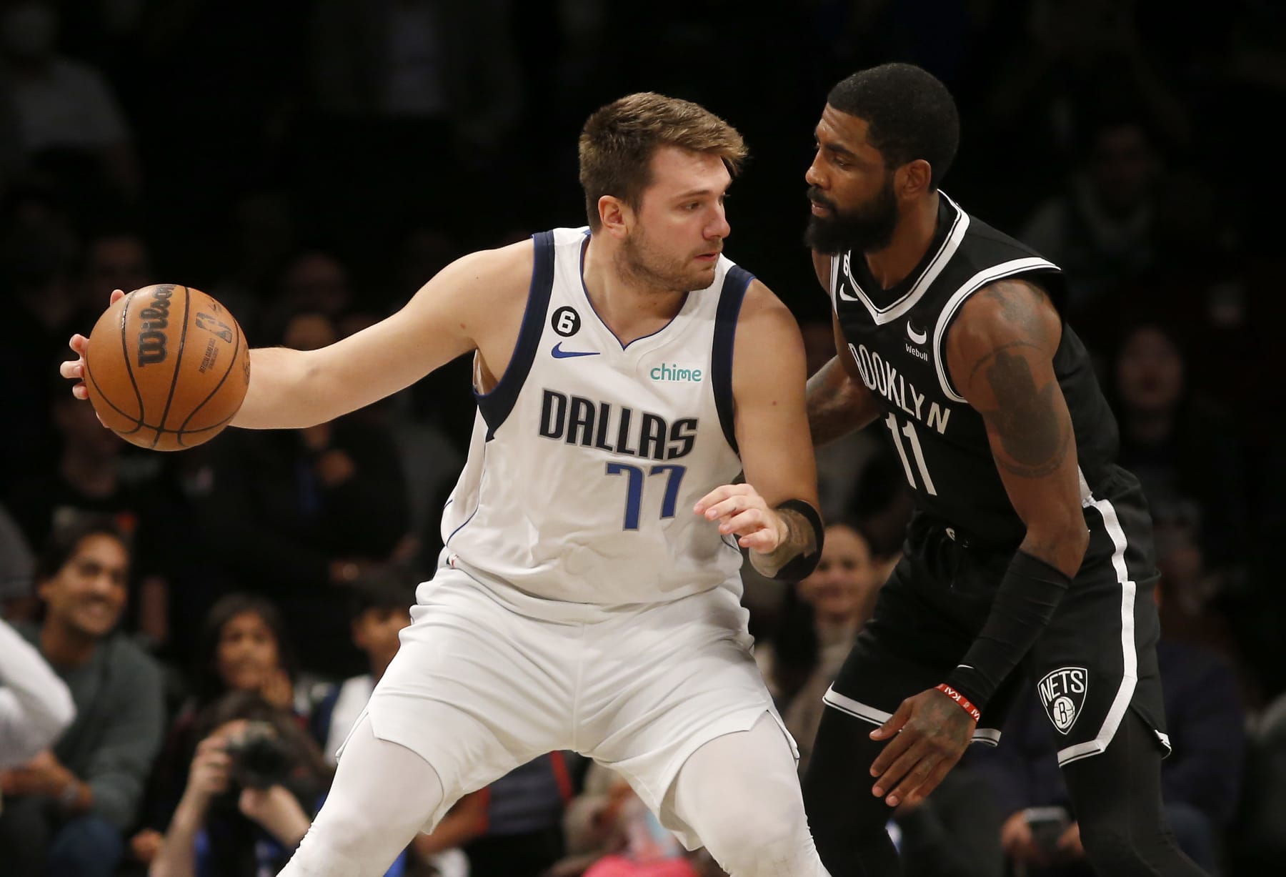 NEW YORK, NEW YORK - OCTOBER 27: (NEW YORK DAILIES OUT)  Luka Doncic #77 of the Dallas Mavericks in action against Kyrie Irving #11 of the Brooklyn Nets at Barclays Center on October 27, 2022 in New York City. The Mavericks defeated the Nets 129-125 in overtime. NOTE TO USER: User expressly acknowledges and agrees that, by downloading and or using this photograph, User is consenting to the terms and conditions of the Getty Images License Agreement. (Photo by Jim McIsaac/Getty Images)