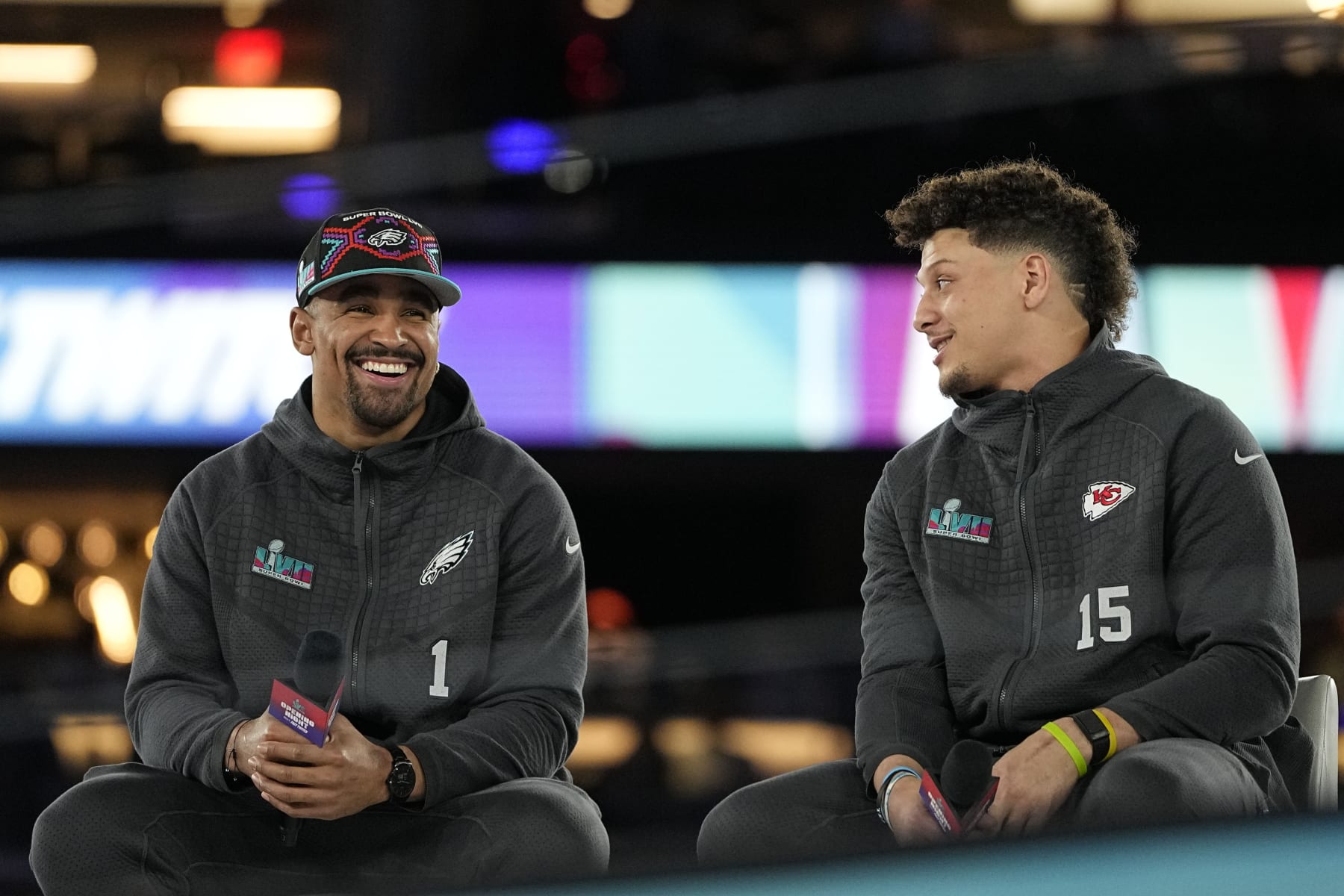 Kansas City Chiefs quarterback Patrick Mahomes, right, and Philadelphia Eagles quarterback Jalen Hurts speak to the media during the NFL football Super Bowl 57 opening night, Monday, Feb. 6, 2023, in Phoenix. The Kansas City Chiefs will play the Philadelphia Eagles on Sunday. (AP Photo/David J. Philip)