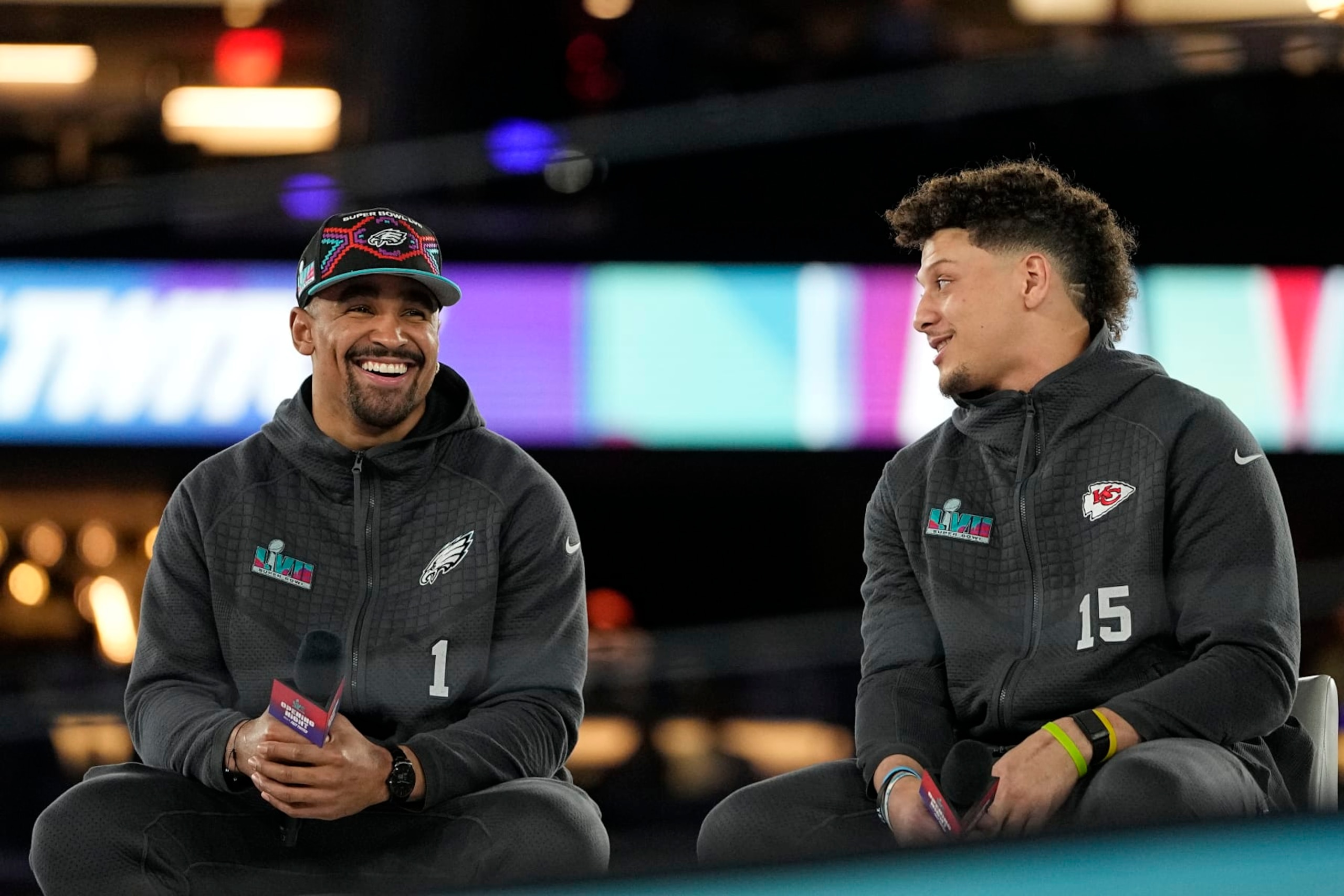 Kansas City Chiefs quarterback Patrick Mahomes, right, and Philadelphia Eagles quarterback Jalen Hurts speak to the media during the NFL football Super Bowl 57 opening night, Monday, Feb. 6, 2023, in Phoenix. The Kansas City Chiefs will play the Philadelphia Eagles on Sunday. (AP Photo/David J. Philip)