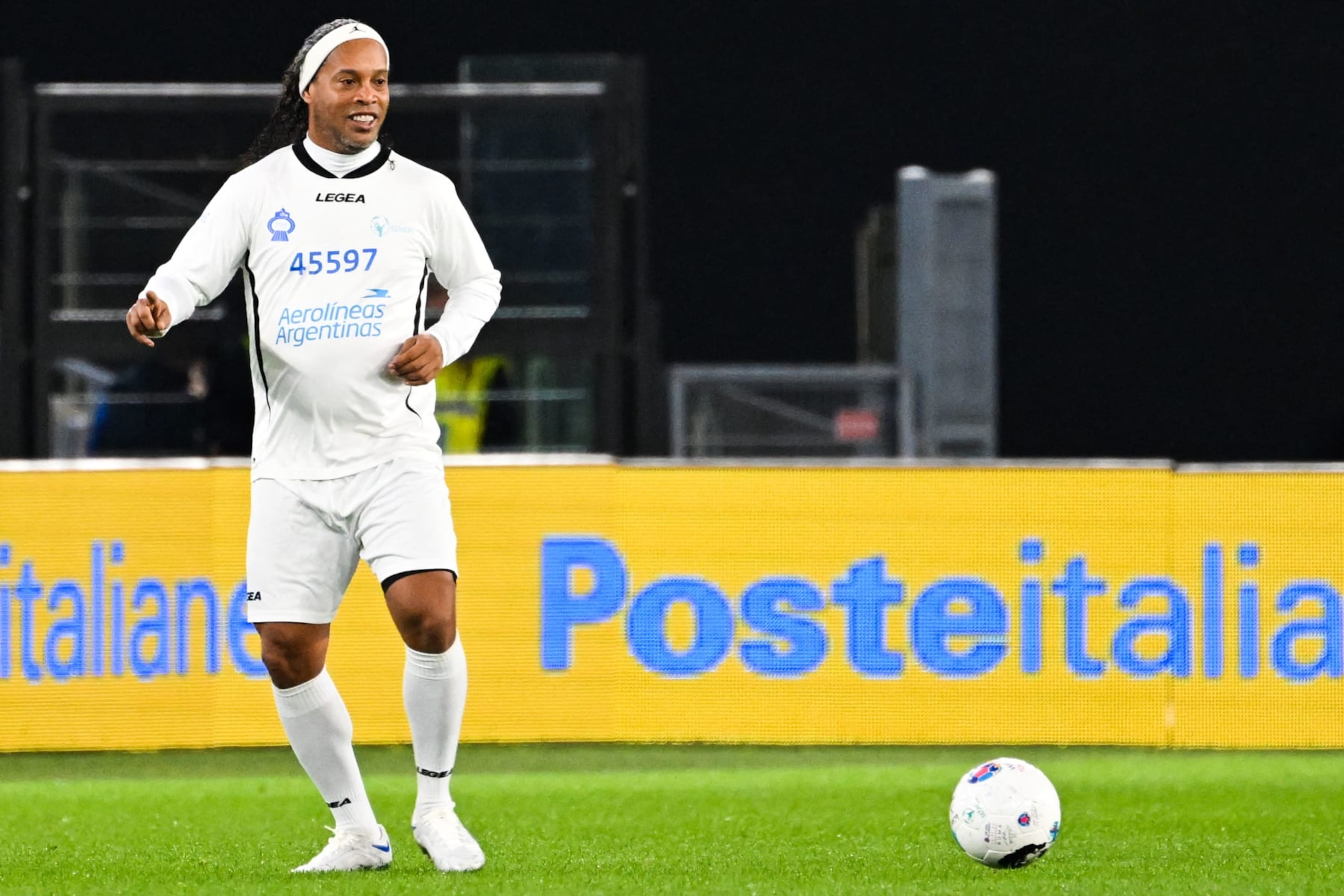 Former Brazilian player Ronaldinho takes part in a friendly tribute "match for peace" in memory of late Argentininan player Diego Maradona, on November 14, 2022 at the Olympic stadium in Rome. - The match is organised by "WePlayForPeace", a foundation set up by Pope Francis. (Photo by Andreas SOLARO / AFP) (Photo by ANDREAS SOLARO/AFP via Getty Images)