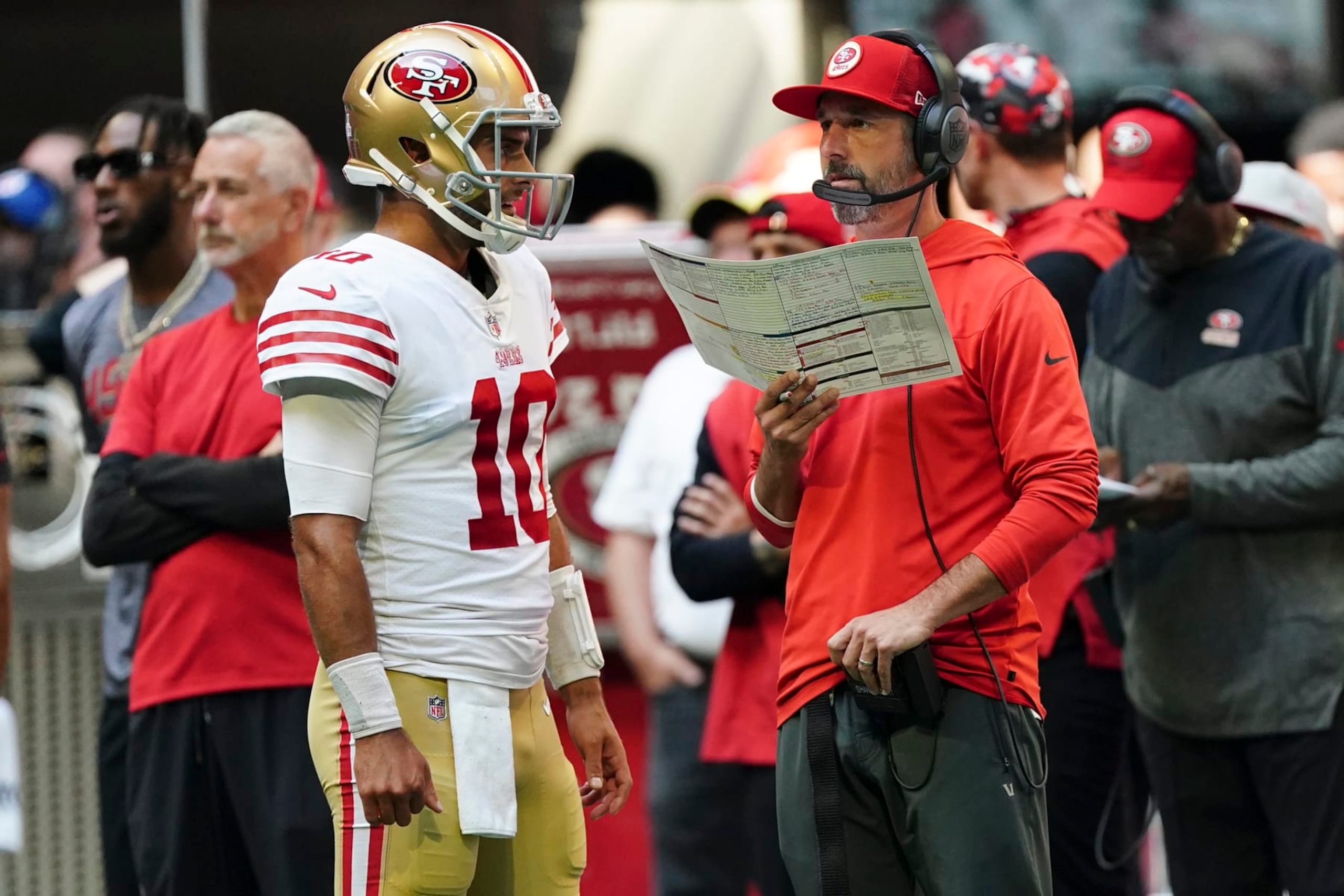 San Francisco 49ers quarterback Jimmy Garoppolo (10) and head coach Kyle Shanahan talk during an NFL football game against the Atlanta Falcons Sunday, Oct. 16, 2022, in Atlanta. (AP Photo/John Bazemore)