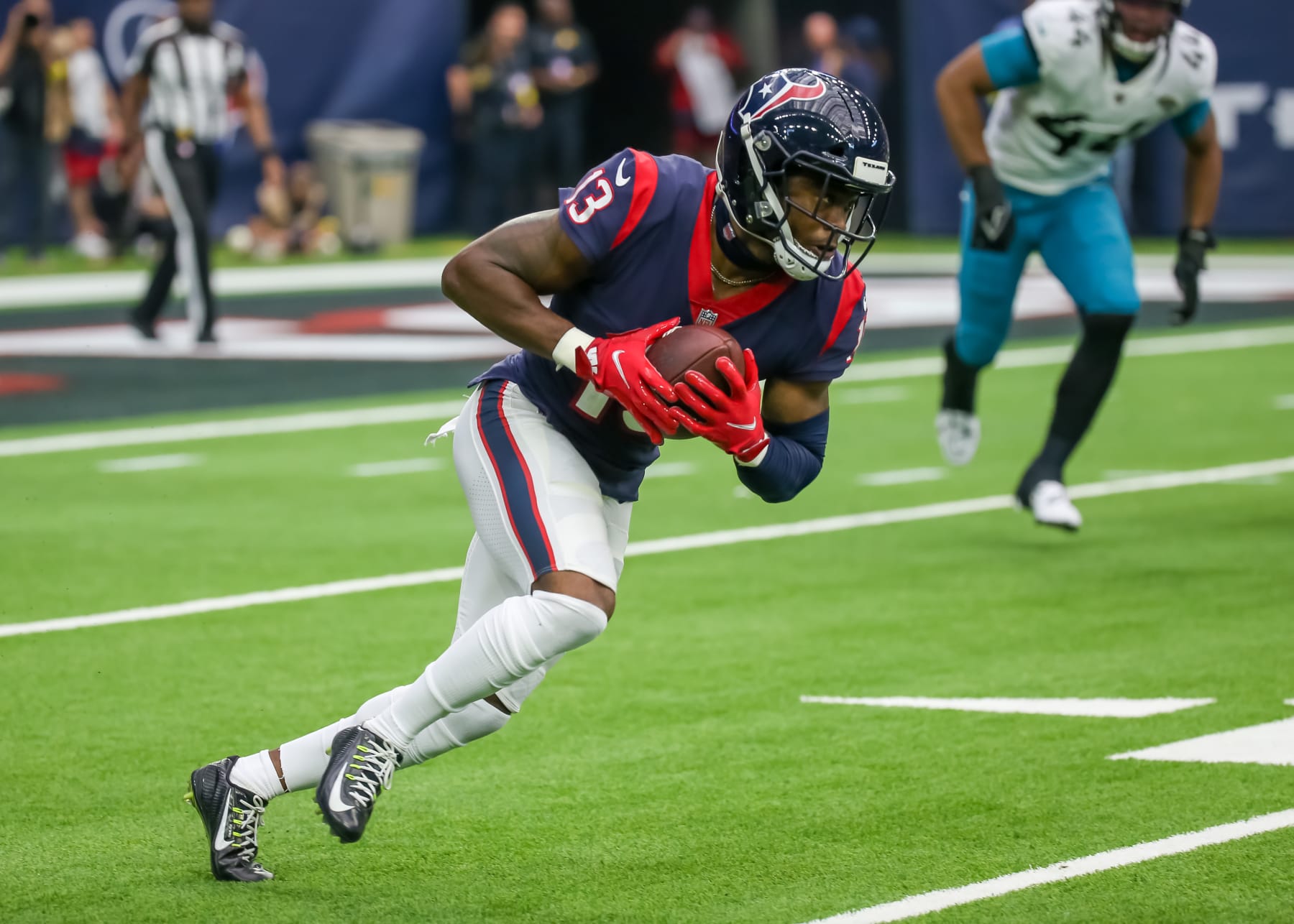 HOUSTON, TX - JANUARY 01:  Houston Texans wide receiver Brandin Cooks (13) carries the ball in the third quarter during the NFL game between the Jacksonville Jaguars and Houston Texans on January 1, 2023 at NRG Stadium at Houston, Texas.  (Photo by Leslie Plaza Johnson/Icon Sportswire via Getty Images)