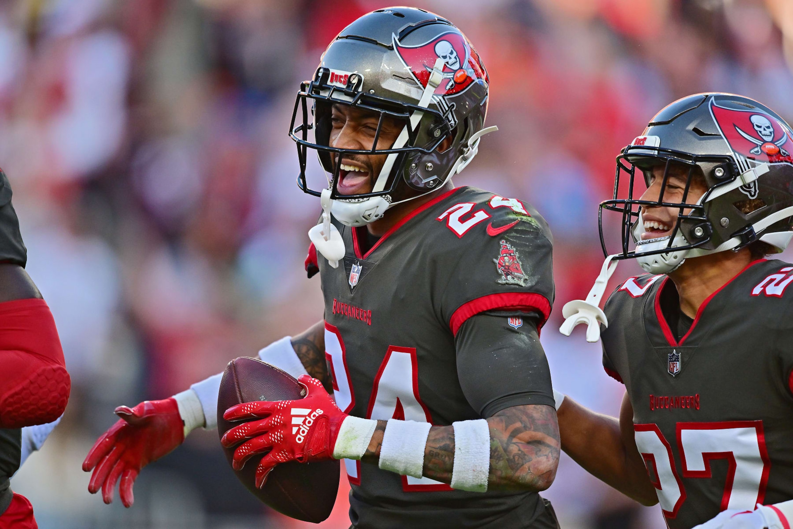 TAMPA, FLORIDA - DECEMBER 18: Carlton Davis III #24 of the Tampa Bay Buccaneers celebrates after an interception during the first quarter in the game against the Cincinnati Bengals at Raymond James Stadium on December 18, 2022 in Tampa, Florida. (Photo by Julio Aguilar/Getty Images)