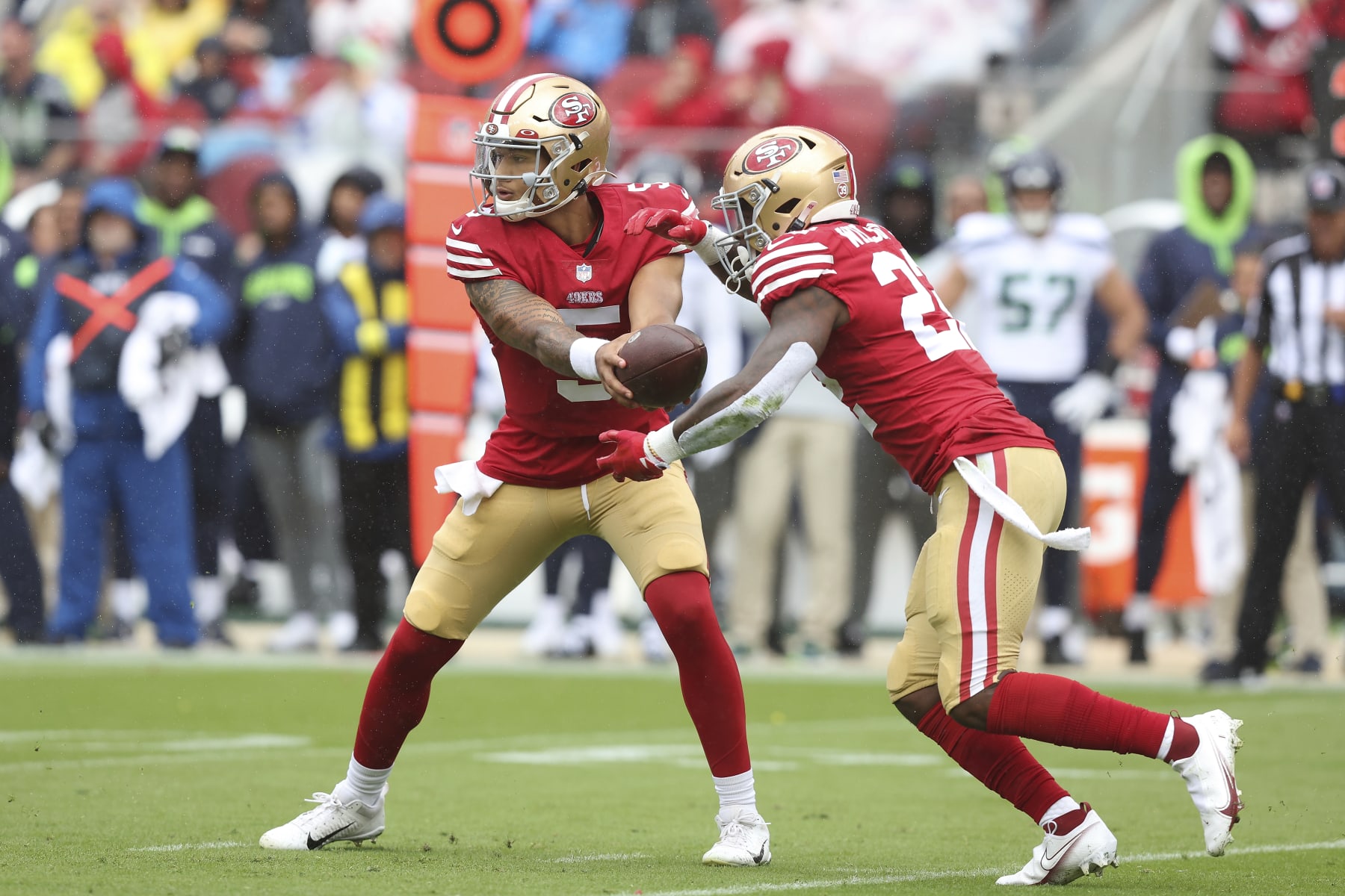 San Francisco 49ers quarterback Trey Lance (5) hands the ball off to running back Jeff Wilson Jr. (22) during an NFL football game Seattle Seahawks, Sunday, Sept. 18, 2022 in Santa Clara, Calif. (AP Photo/Lachlan Cunningham)