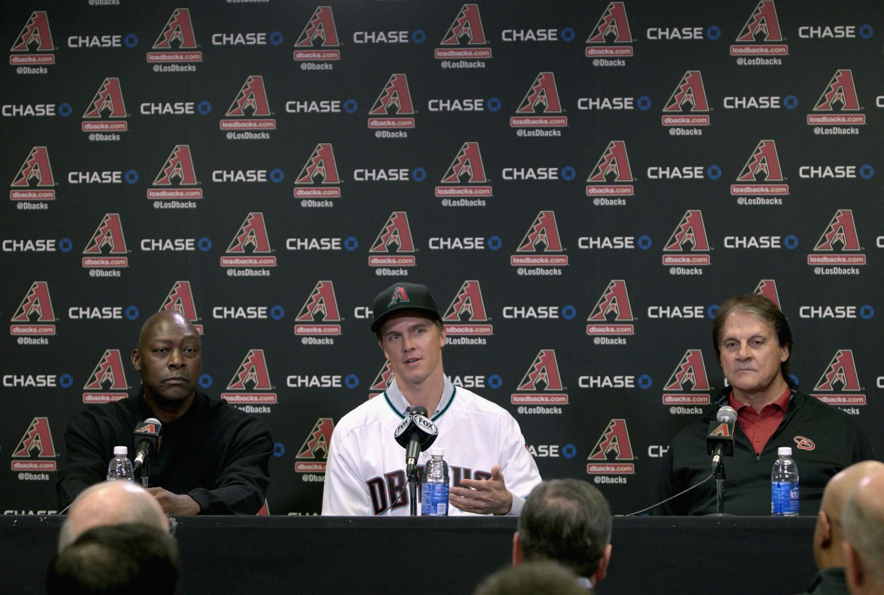 PHOENIX, AZ - DECEMBER 11:  Free agent aquisition Zack Greinke of the Arizona Diamondbacks speaks to the media as Chief Baseball Officer Tony La Russa (R) and General Manager Dave Stewart look on during a press conference at Chase Field on December 11, 2015 in Phoenix, Arizona.  (Photo by Ralph Freso/Getty Images)