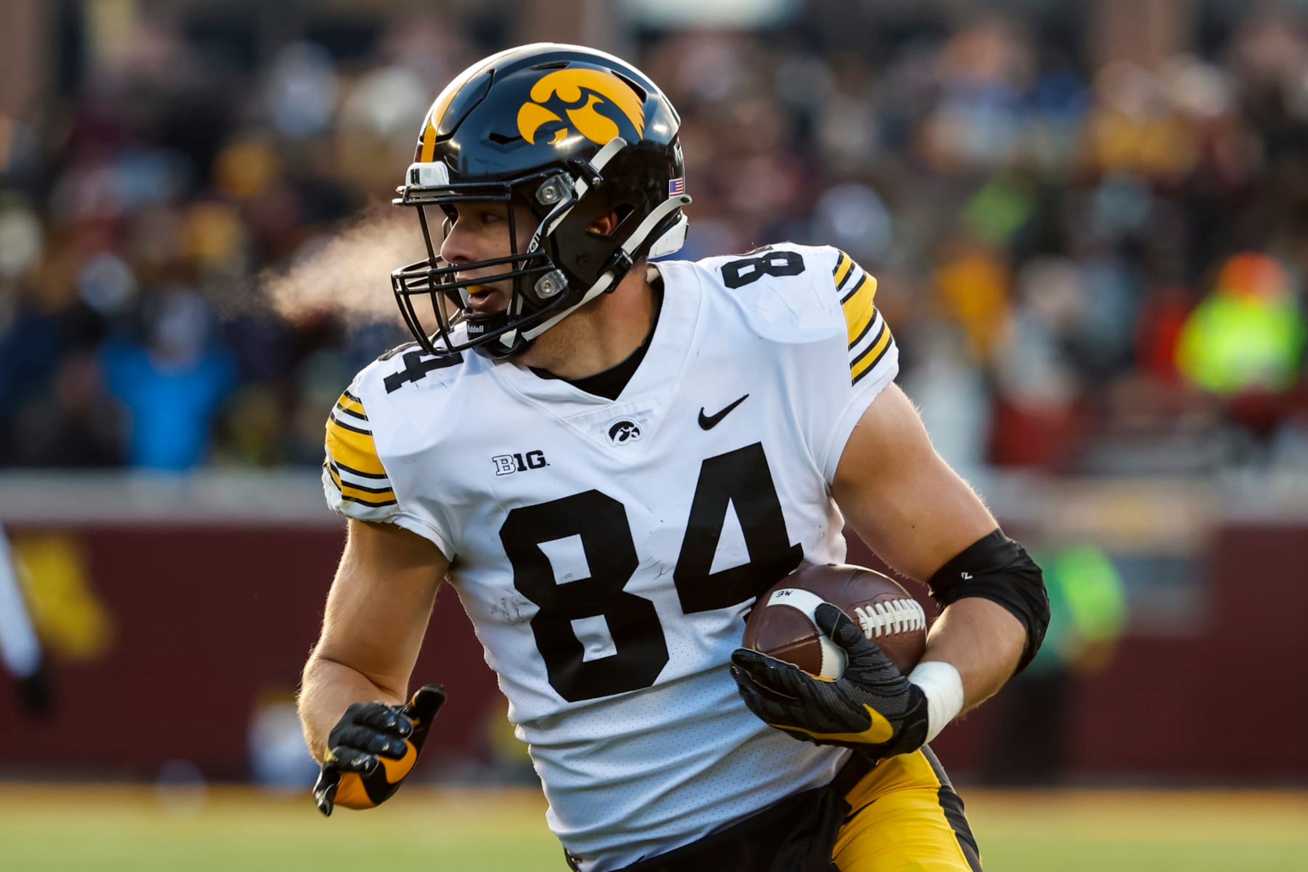 MINNEAPOLIS, MN - NOVEMBER 19: Sam LaPorta #84 of the Iowa Hawkeyes runs with the ball against the Minnesota Golden Gophers in the first quarter of the game at Huntington Bank Stadium on November 19, 2022 in Minneapolis, Minnesota. The Hawkeyes defeated the Golden Gophers 13-10. (Photo by David Berding/Getty Images)