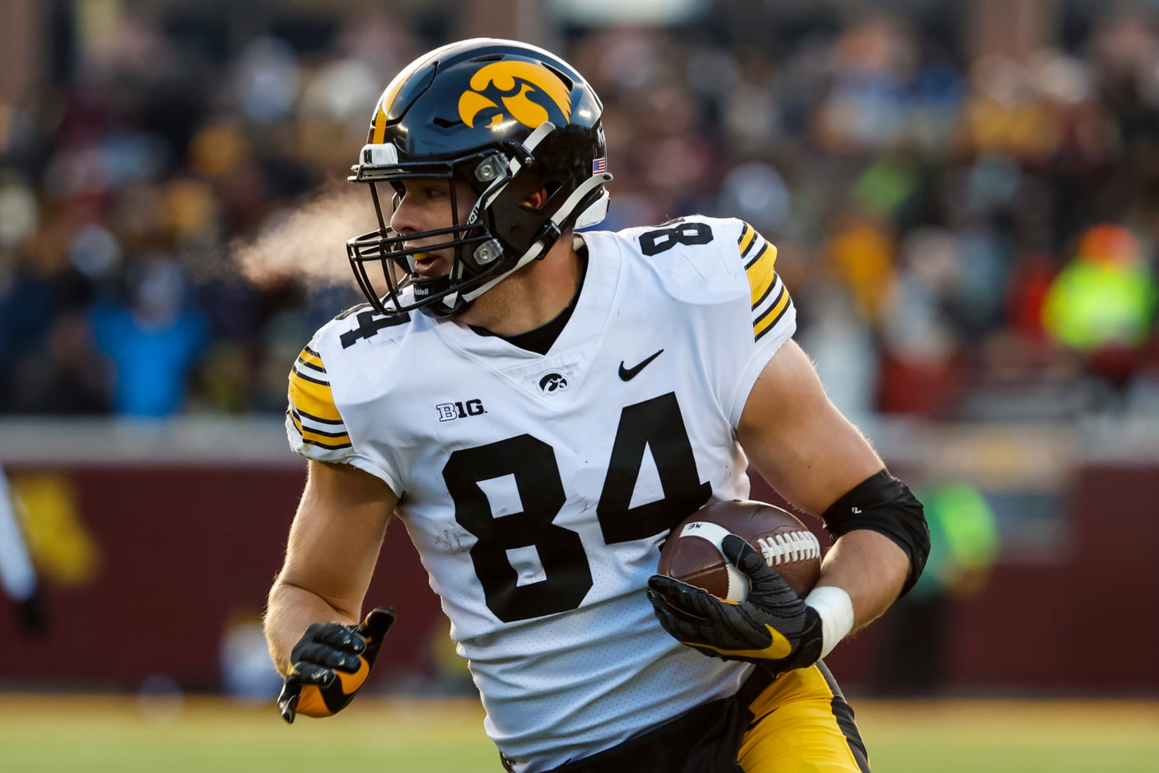 MINNEAPOLIS, MN - NOVEMBER 19: Sam LaPorta #84 of the Iowa Hawkeyes runs with the ball against the Minnesota Golden Gophers in the first quarter of the game at Huntington Bank Stadium on November 19, 2022 in Minneapolis, Minnesota. The Hawkeyes defeated the Golden Gophers 13-10. (Photo by David Berding/Getty Images)