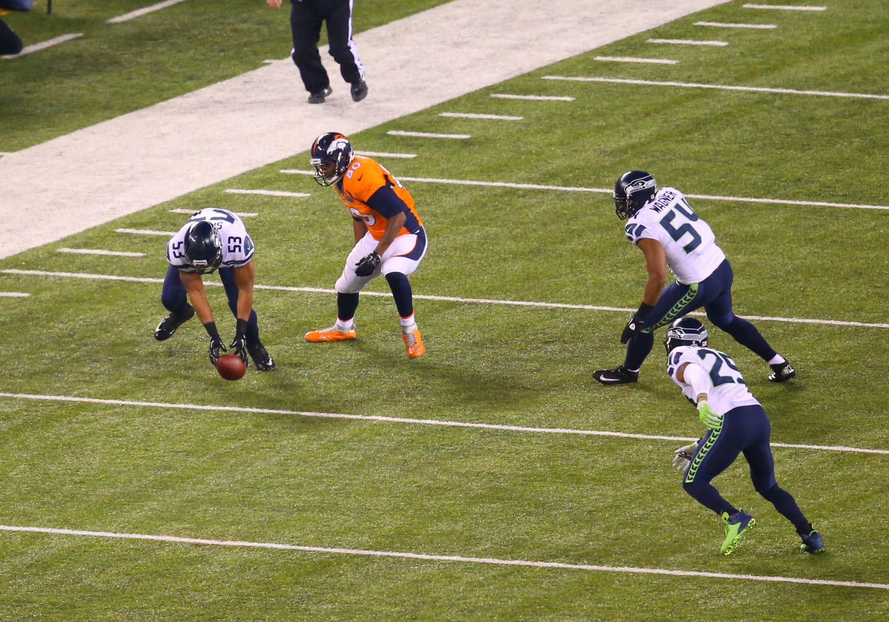 02 February 2014: LB Malcolm Smith (53) of the Seattle Seahawks picks up the ball fumbled by TE Julius Thomas (80) of the Denver Broncos during Super Bowl XLVIII between the Denver Broncos and the Seattle Seahawks at MetLife Stadium in East Rutherford, NJ. (Photo by Rich Graessle/Icon SMI/Corbis/Icon Sportswire via Getty Images)