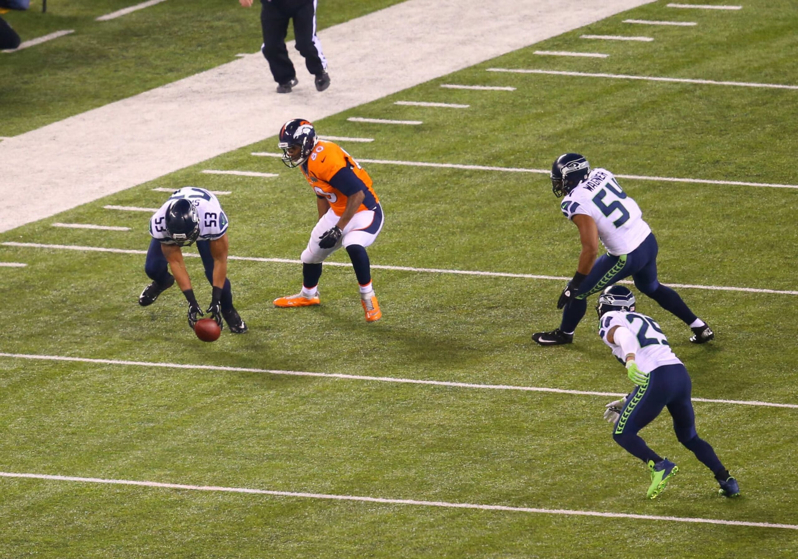 02 February 2014: LB Malcolm Smith (53) of the Seattle Seahawks picks up the ball fumbled by TE Julius Thomas (80) of the Denver Broncos during Super Bowl XLVIII between the Denver Broncos and the Seattle Seahawks at MetLife Stadium in East Rutherford, NJ. (Photo by Rich Graessle/Icon SMI/Corbis/Icon Sportswire via Getty Images)