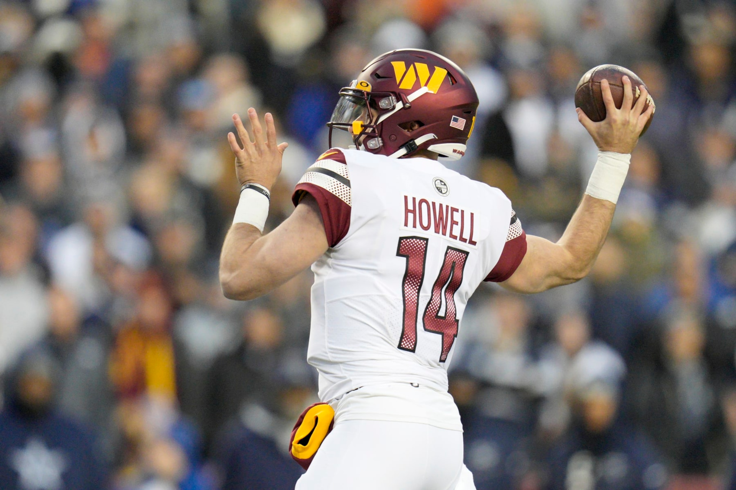 LANDOVER, MARYLAND - JANUARY 08: Sam Howell #14 of the Washington Commanders throws a pass during the first half of the game against the Dallas Cowboys at FedExField on January 08, 2023 in Landover, Maryland. (Photo by Jess Rapfogel/Getty Images)