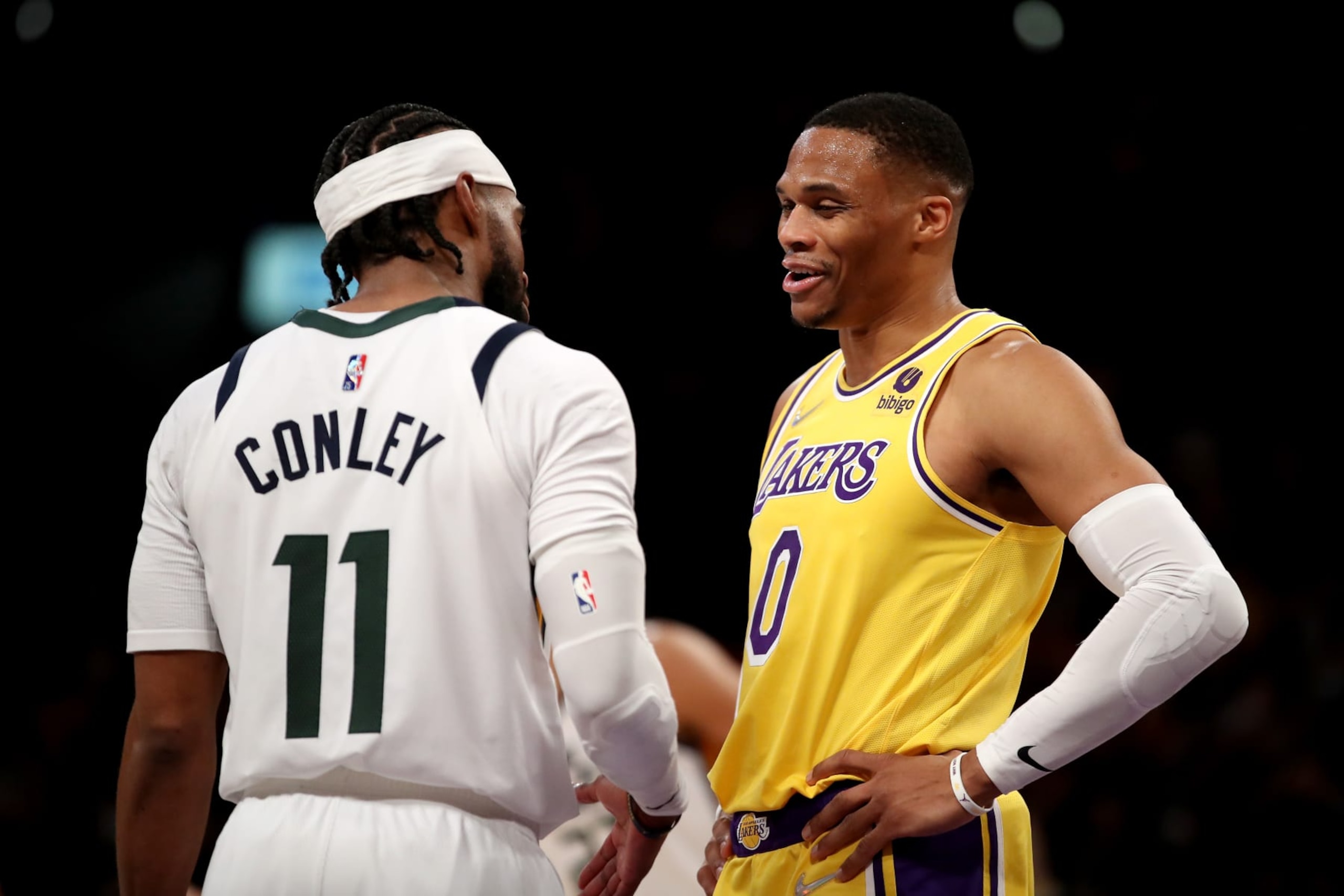LOS ANGELES, CALIFORNIA - JANUARY 17: Mike Conley #11 of the Utah Jazz and Russell Westbrook #0 of the Los Angeles Lakers talk after the game at Crypto.com Arena on January 17, 2022 in Los Angeles, California. NOTE TO USER: User expressly acknowledges and agrees that, by downloading and/or using this photograph, User is consenting to the terms and conditions of the Getty Images License Agreement. (Photo by Katelyn Mulcahy/Getty Images)