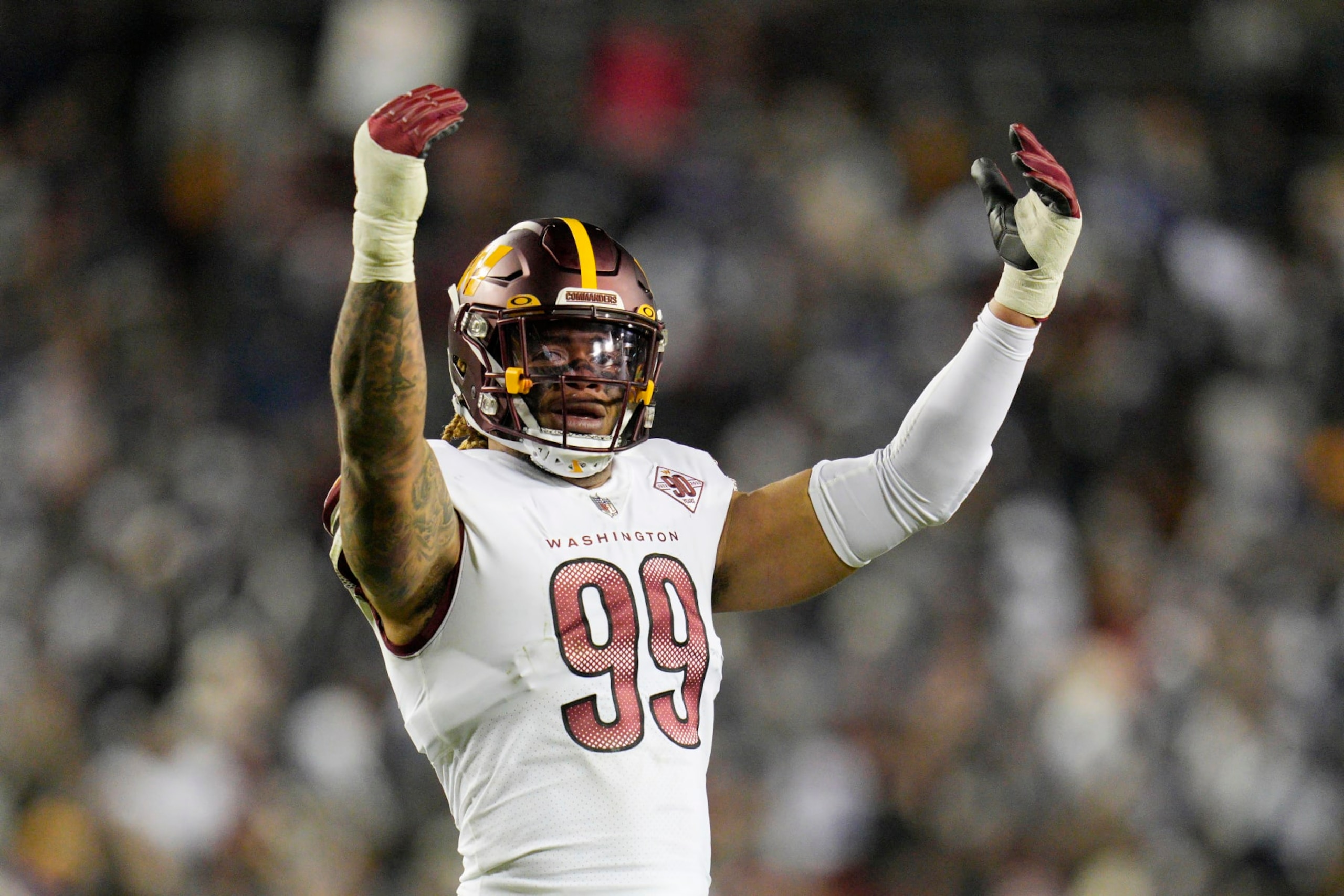 LANDOVER, MARYLAND - JANUARY 08: Chase Young #99 of the Washington Commanders looks on during the first half of the game against the Dallas Cowboys at FedExField on January 08, 2023 in Landover, Maryland. (Photo by Jess Rapfogel/Getty Images)
