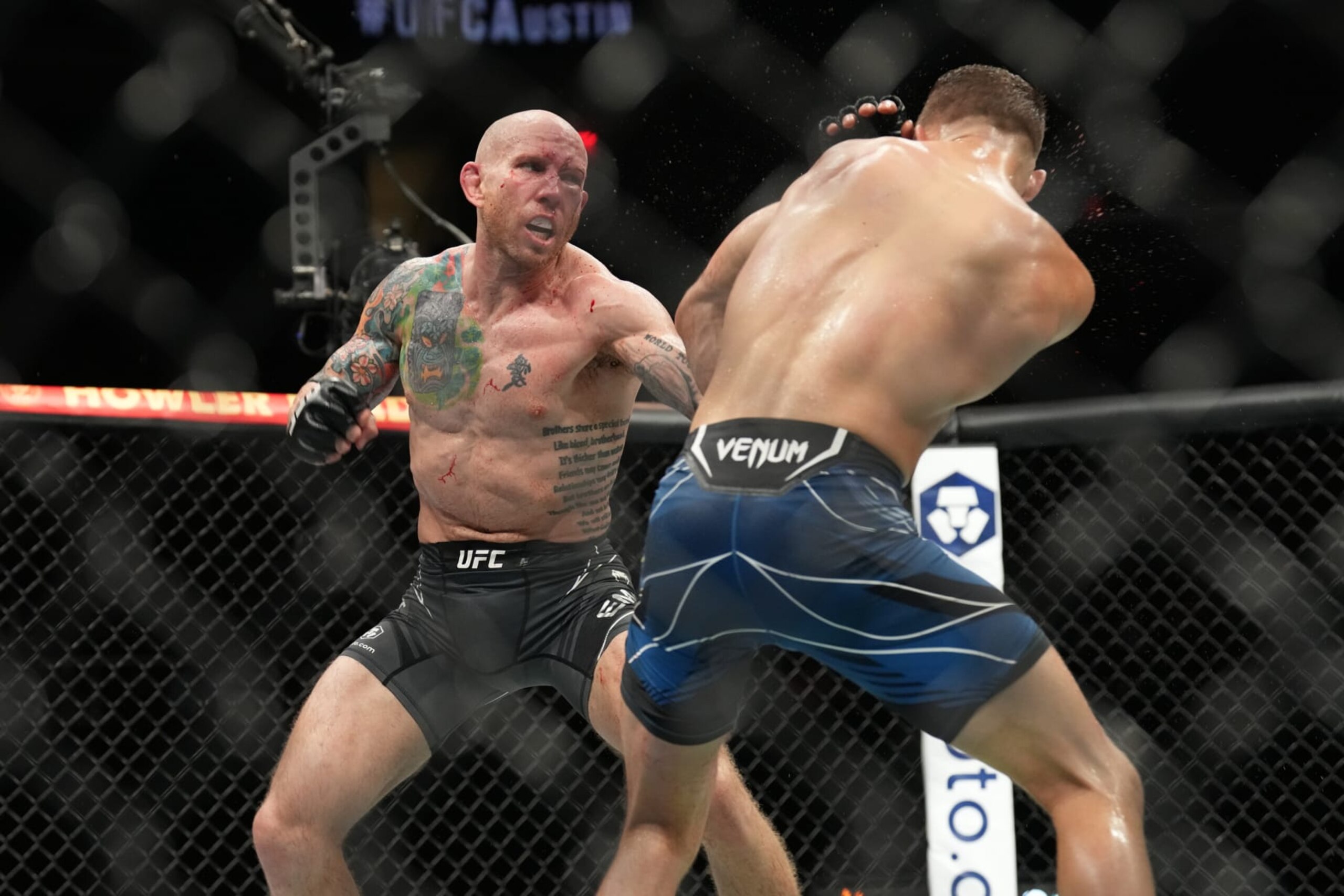 AUSTIN, TX - JUNE 18: (L-R) Josh Emmett punches Calvin Kattar in their featherweight bout during the UFC Fight Night: Kattar v Emmett event at June 18, 2022, Moody Center on in Austin, Texas. (Photo by Louis Grasse/PxImages/Icon Sportswire via Getty Images) AUSTIN, TX - JUNE 18: (L-R) Josh Emmett punches Calvin Kattar in their featherweight bout during the UFC Fight Night: Kattar v Emmett event at June 18, 2022, Moody Center on in Austin, Texas. (Photo by Louis Grasse/PxImages/Icon Sportswire via Getty Images)