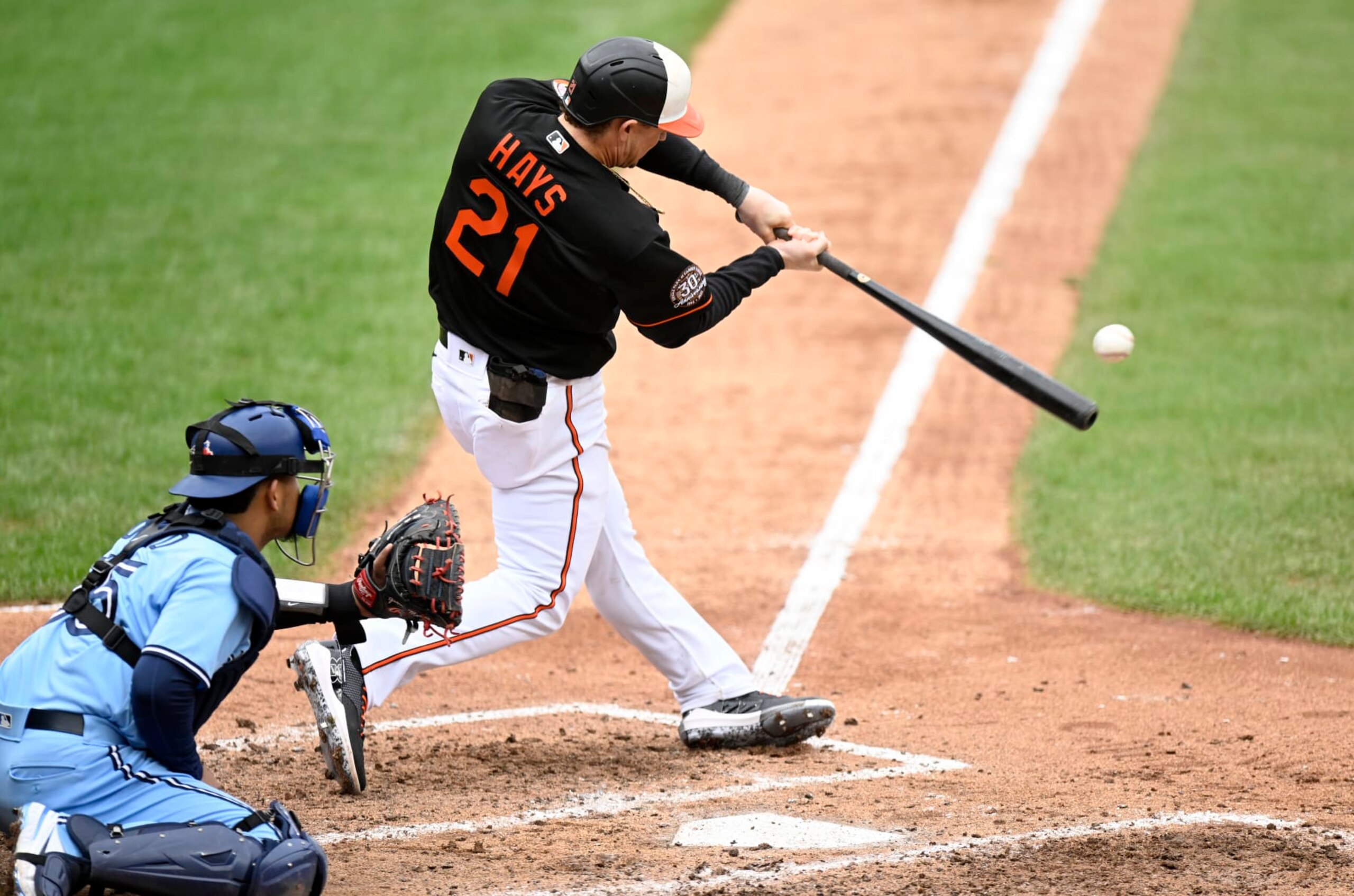 BALTIMORE, MARYLAND - OCTOBER 05: Austin Hays #21 of the Baltimore Orioles drives in two runs with a double in the sixth inning against the Toronto Blue Jays during game one of a doubleheader at Oriole Park at Camden Yards on October 05, 2022 in Baltimore, Maryland. (Photo by Greg Fiume/Getty Images)