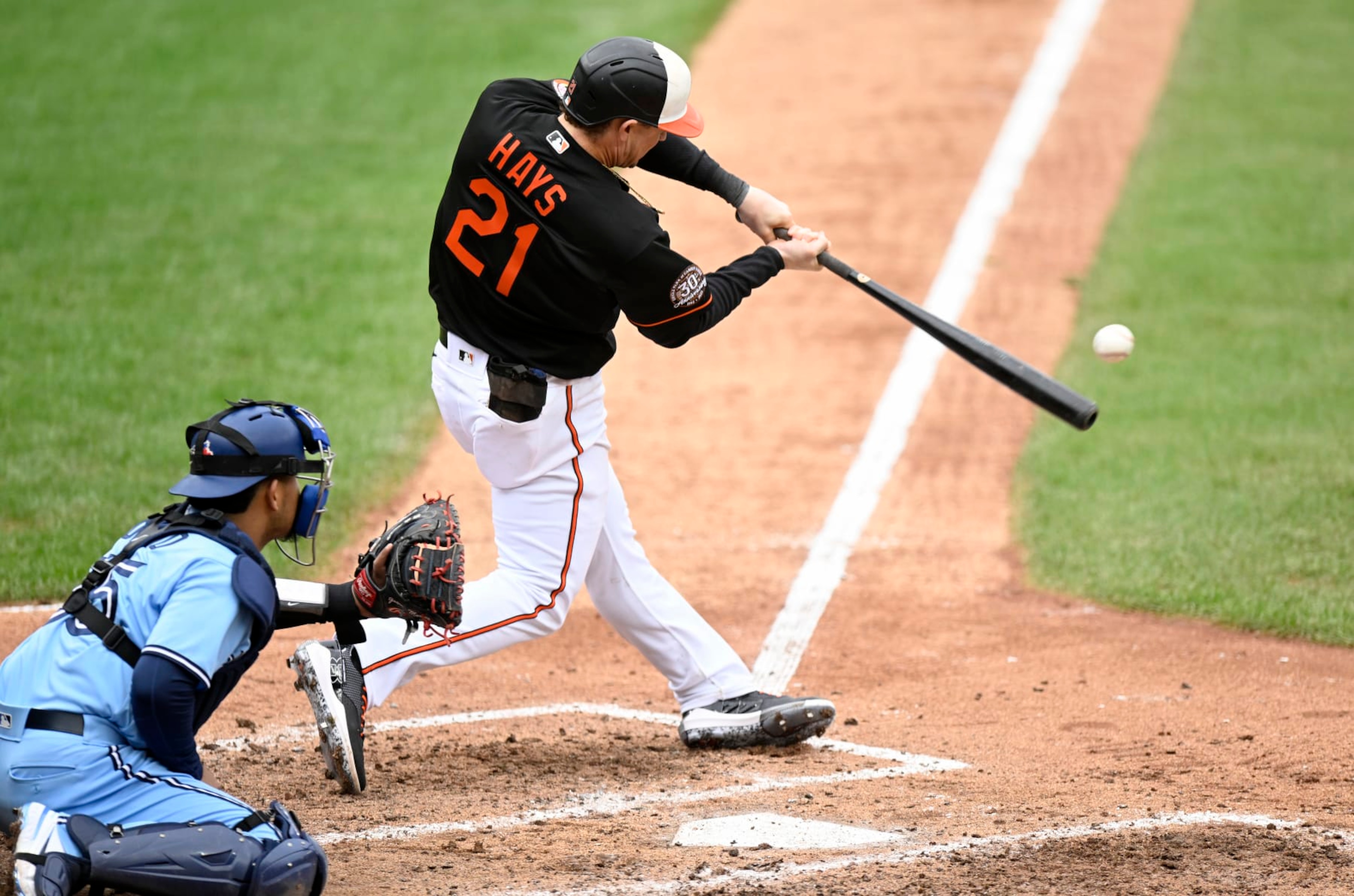 BALTIMORE, MARYLAND - OCTOBER 05: Austin Hays #21 of the Baltimore Orioles drives in two runs with a double in the sixth inning against the Toronto Blue Jays during game one of a doubleheader at Oriole Park at Camden Yards on October 05, 2022 in Baltimore, Maryland. (Photo by Greg Fiume/Getty Images)