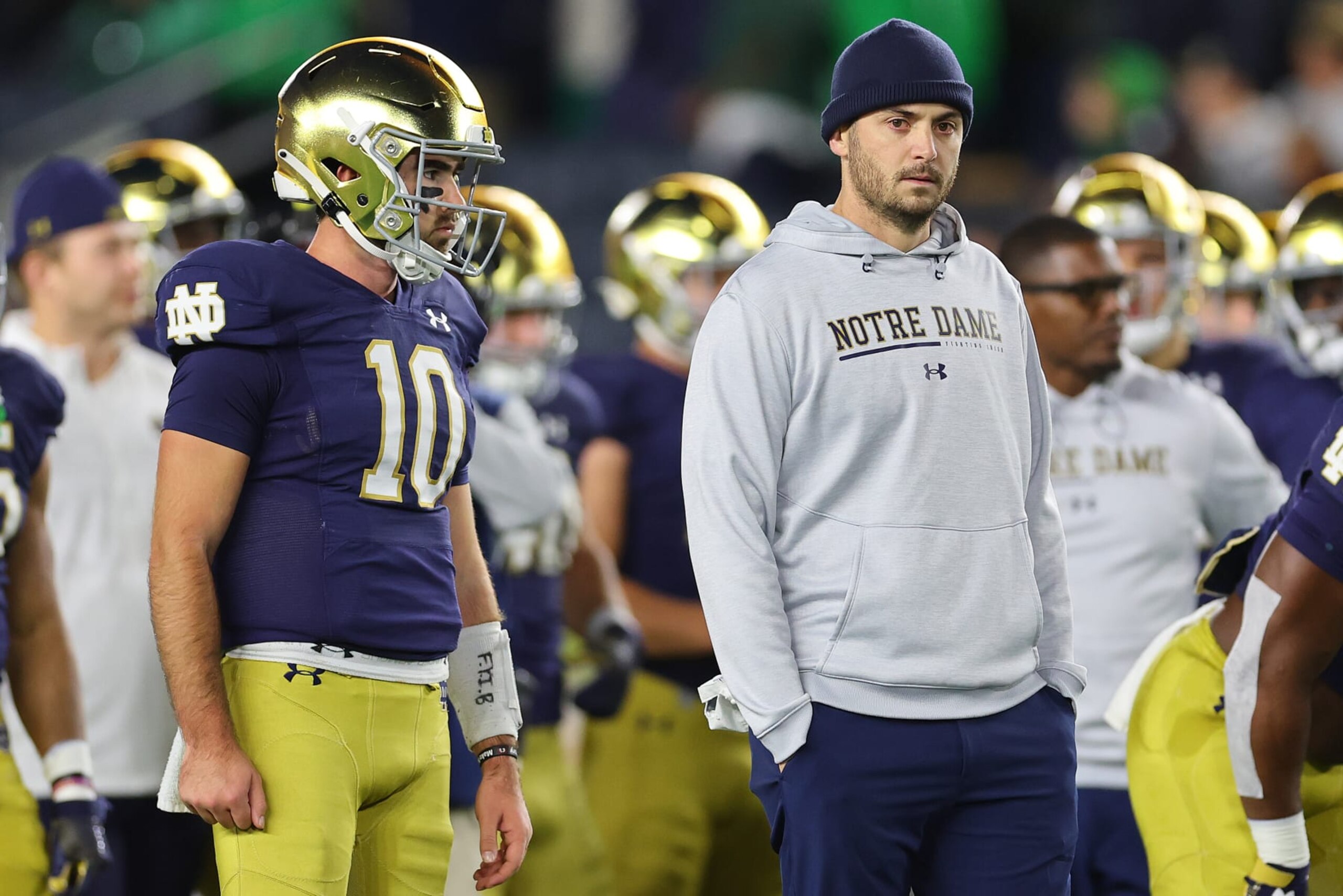 SOUTH BEND, INDIANA - NOVEMBER 05: Drew Pyne #10 and offensive coordinator Tommy Rees of the Notre Dame Fighting Irish look on prior to the game against the Clemson Tigers at Notre Dame Stadium on November 05, 2022 in South Bend, Indiana. (Photo by Michael Reaves/Getty Images) SOUTH BEND, INDIANA - NOVEMBER 05: Drew Pyne #10 and offensive coordinator Tommy Rees of the Notre Dame Fighting Irish look on prior to the game against the Clemson Tigers at Notre Dame Stadium on November 05, 2022 in South Bend, Indiana. (Photo by Michael Reaves/Getty Images)