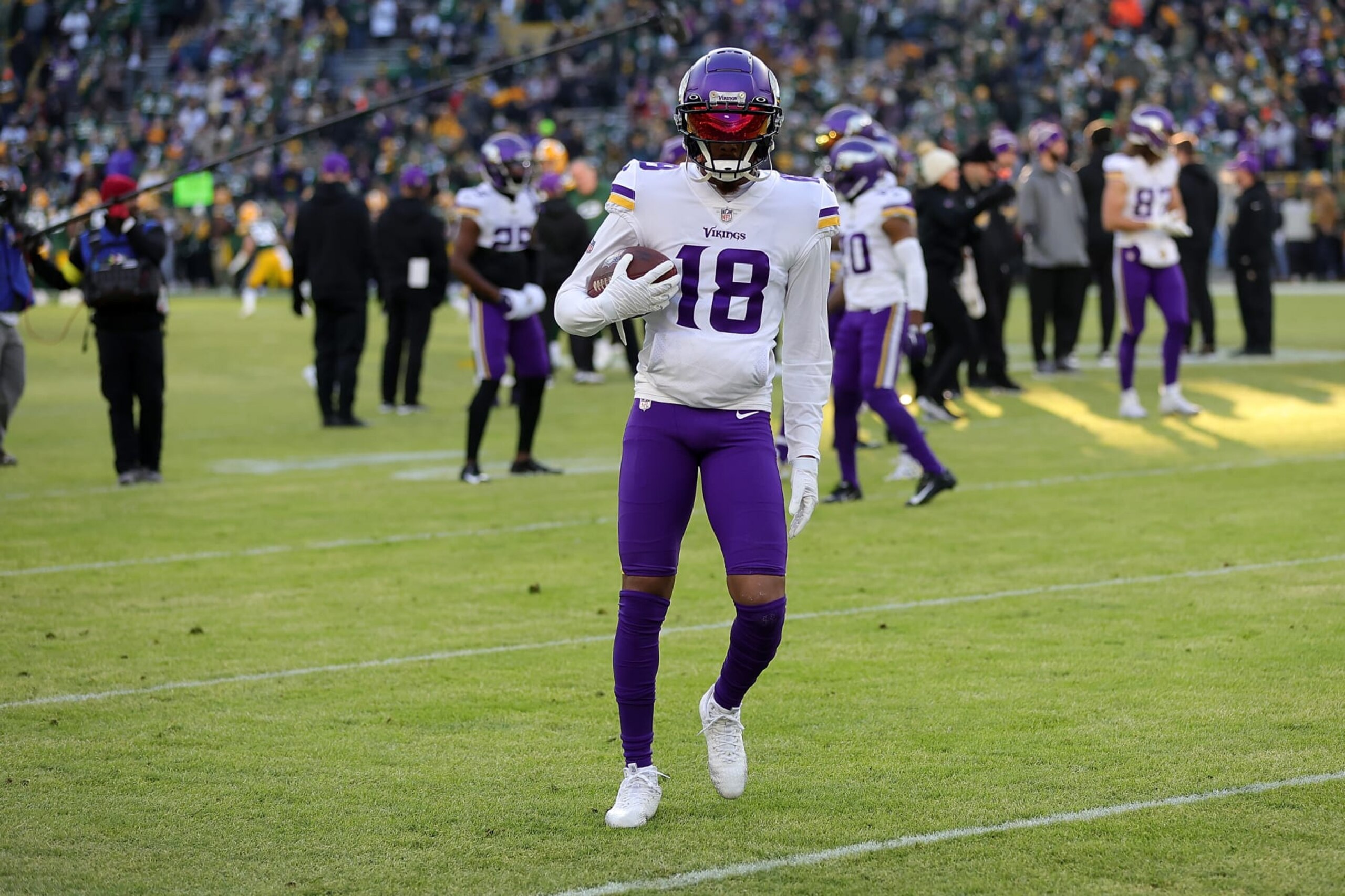 GREEN BAY, WISCONSIN - JANUARY 01: Justin Jefferson #18 of the Minnesota Vikings participates in warmups prior to a game against the Green Bay Packers at Lambeau Field on January 01, 2023 in Green Bay, Wisconsin. The Packers defeated the Vikings 41-17.  (Photo by Stacy Revere/Getty Images)