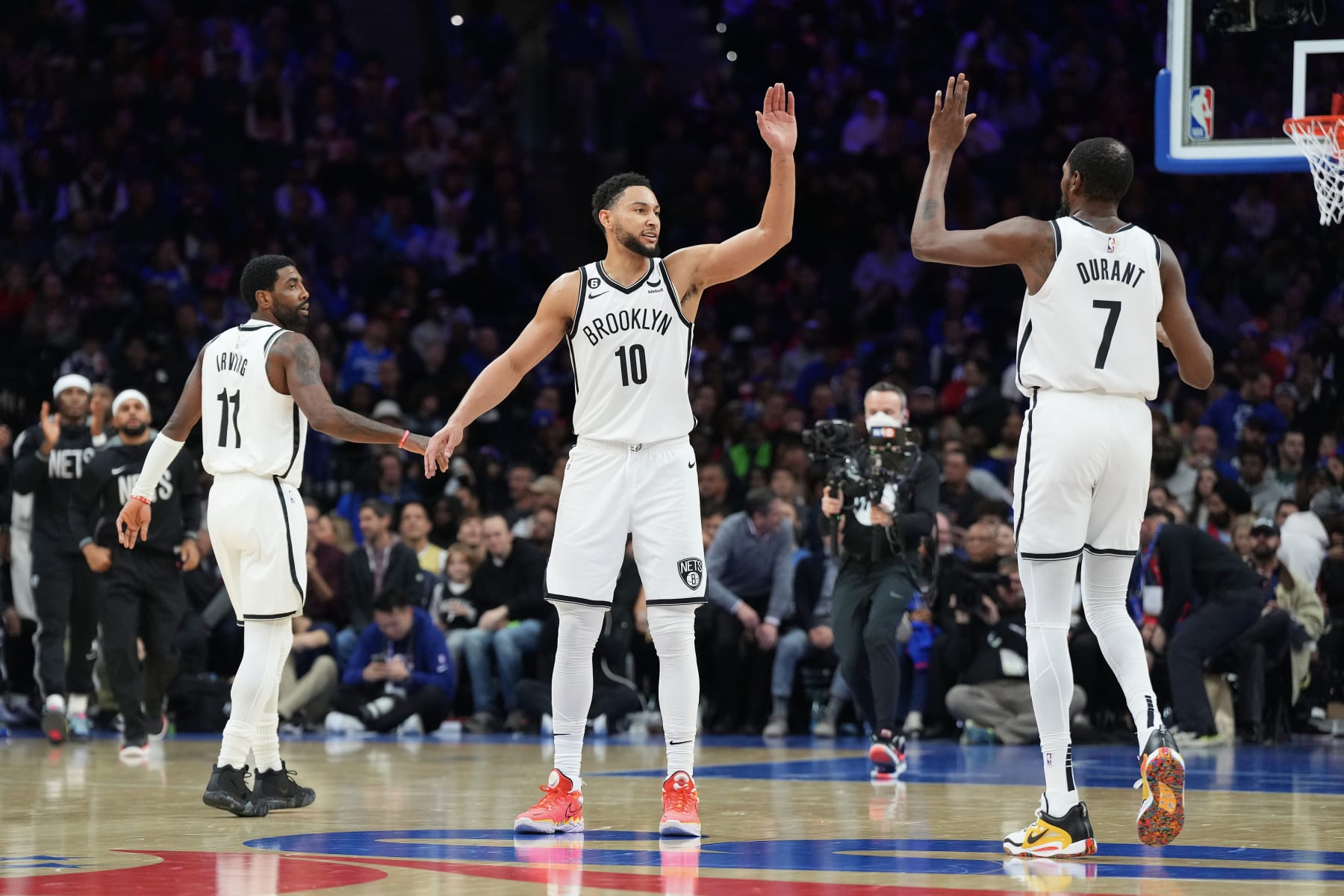 PHILADELPHIA, PA - NOVEMBER 22: Kyrie Irving #11, Ben Simmons #10, and Kevin Durant #7 of the Brooklyn Nets react against the Philadelphia 76ers at the Wells Fargo Center on November 22, 2022 in Philadelphia, Pennsylvania. NOTE TO USER: User expressly acknowledges and agrees that, by downloading and or using this photograph, User is consenting to the terms and conditions of the Getty Images License Agreement. (Photo by Mitchell Leff/Getty Images)